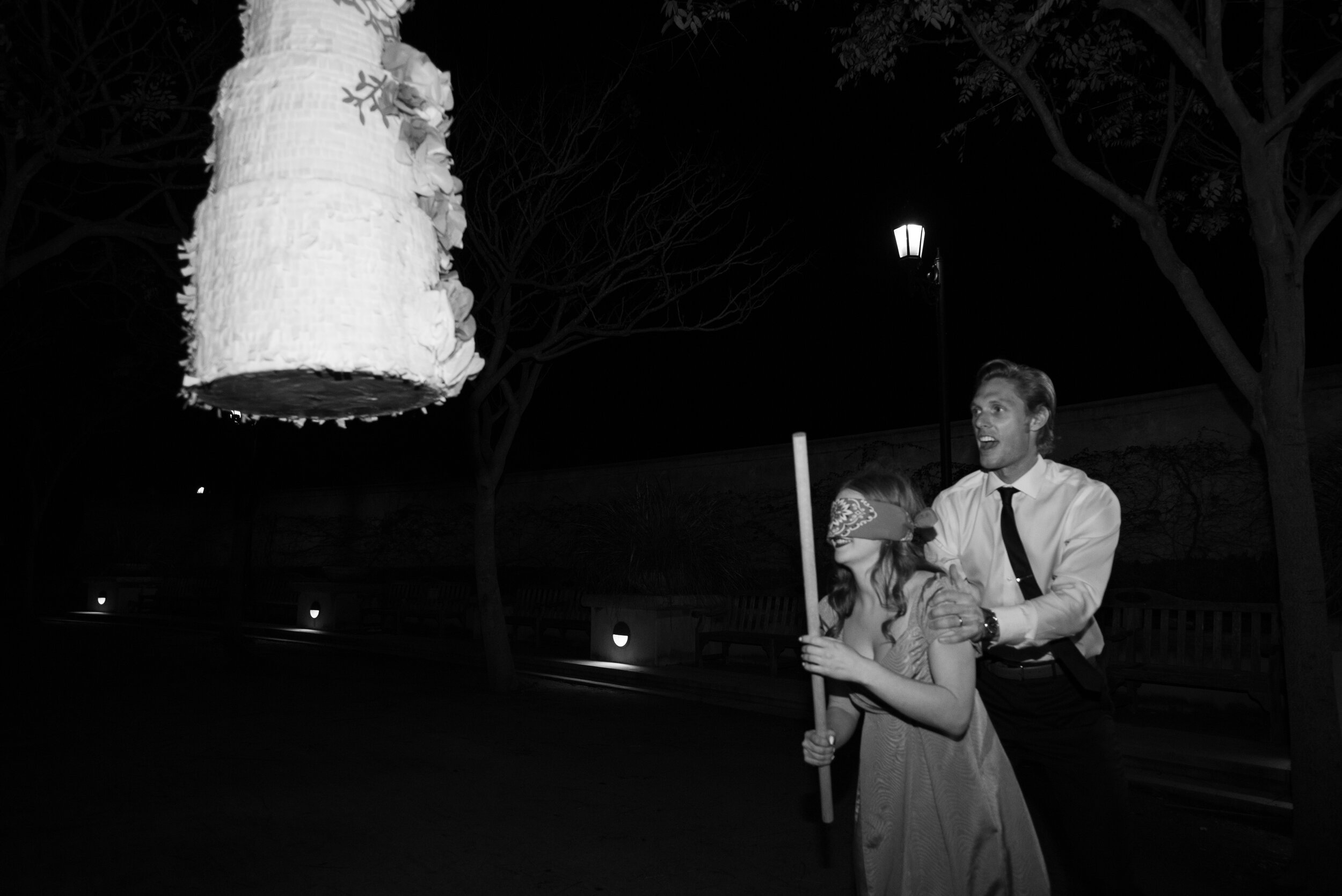 www.santabarbarawedding.com | KB Events | Moaba Wedding Photography | Bride and Groom About to Hit a Cake Pinata