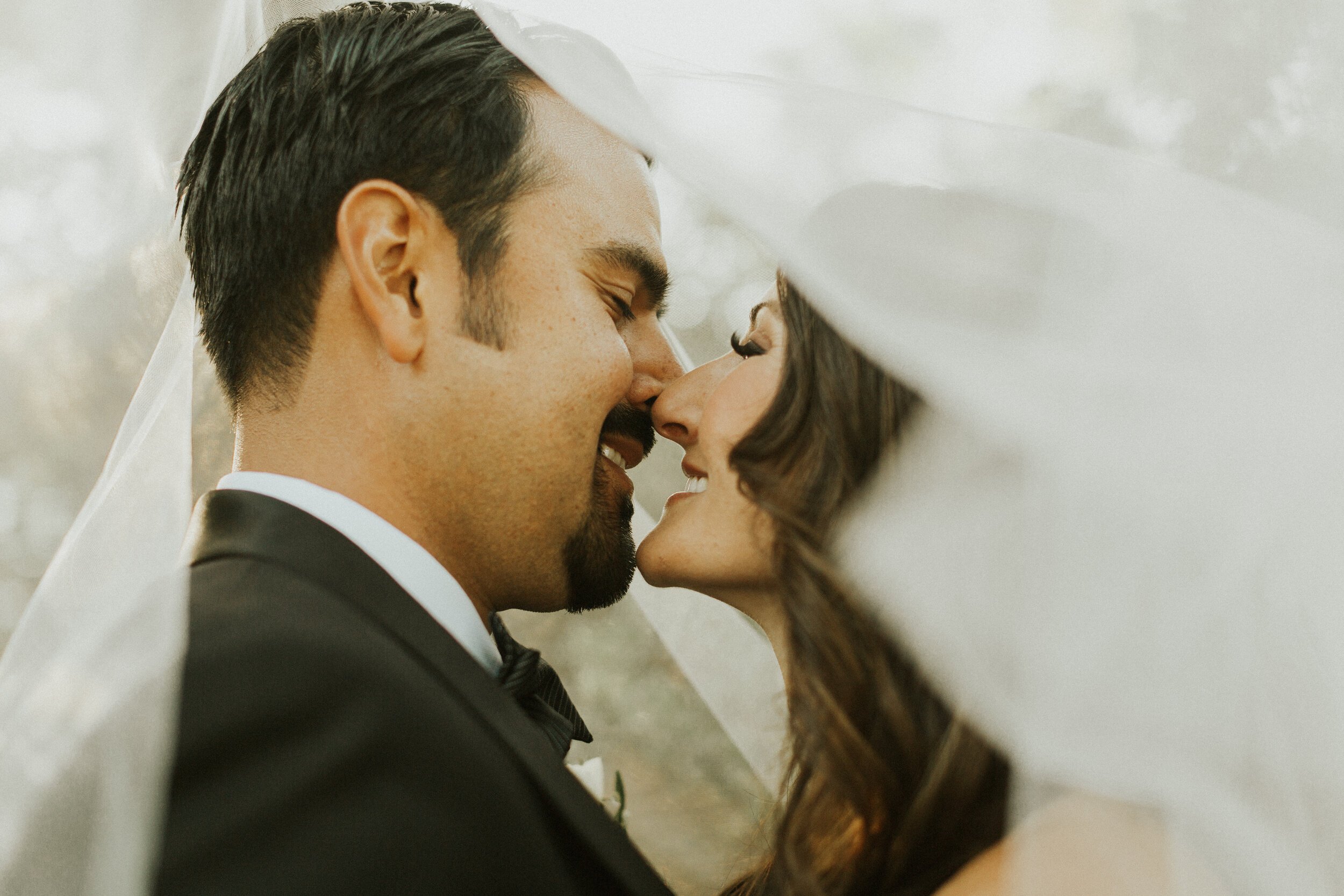 www.santabarbarawedding.com | KB Events | Morgan Adeline Photography | Couple Kiss Under Veil