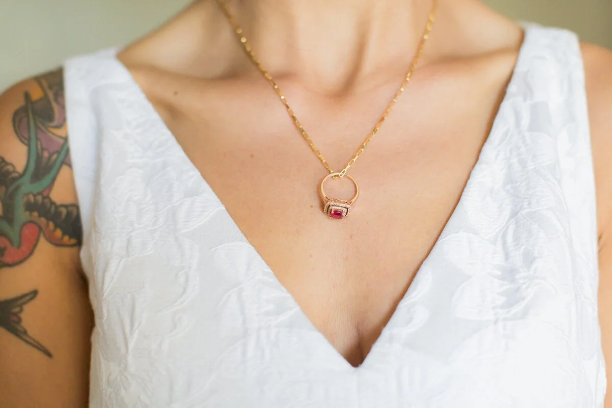 www.santabarbarawedding.com | Aurelia D’Amore Photography | Santa Barbara Courthouse | Haute Blossoms Floral | Alice and Olivia | Bride’s Ring on Her Necklace