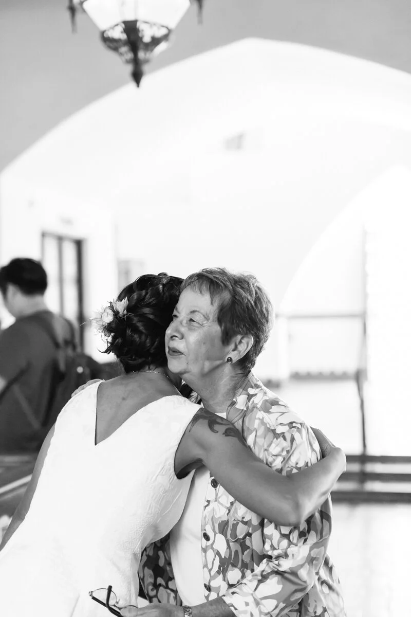 www.santabarbarawedding.com | Aurelia D’Amore Photography | Santa Barbara Courthouse | Haute Blossoms Floral | Alice and Olivia | Bride Hugging Mother