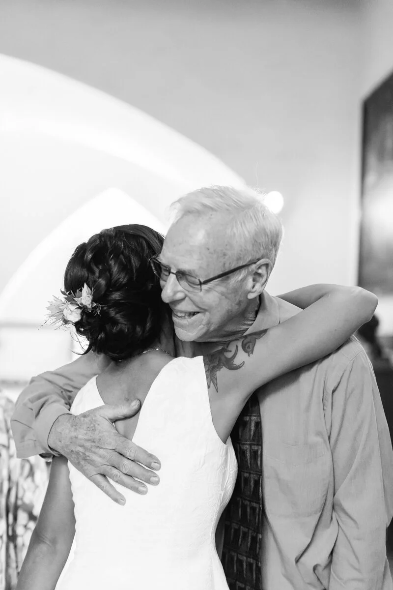 www.santabarbarawedding.com | Aurelia D’Amore Photography | Santa Barbara Courthouse | Haute Blossoms Floral | Alice and Olivia | Bride Hugging Father
