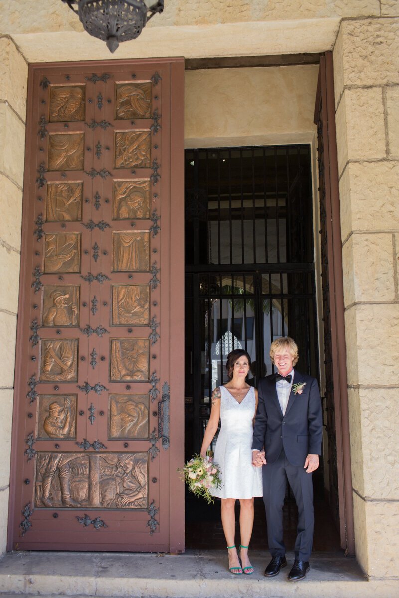 www.santabarbarawedding.com | Aurelia D’Amore Photography | Santa Barbara Courthouse | Haute Blossoms Floral | Alice and Olivia | Bride and Groom Outside the Courthouse