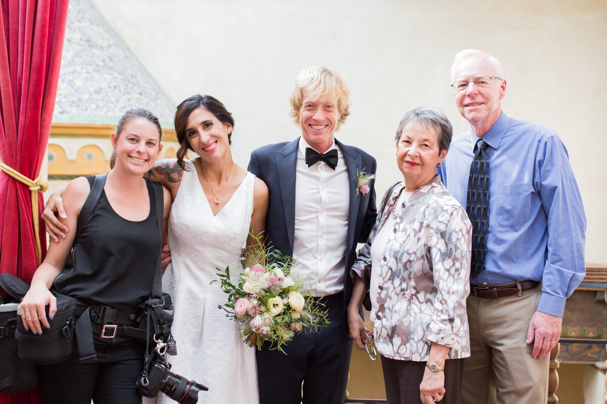 www.santabarbarawedding.com | Aurelia D’Amore Photography | Santa Barbara Courthouse | Haute Blossoms Floral | Alice and Olivia | Bride and Groom with Parents and Photographer
