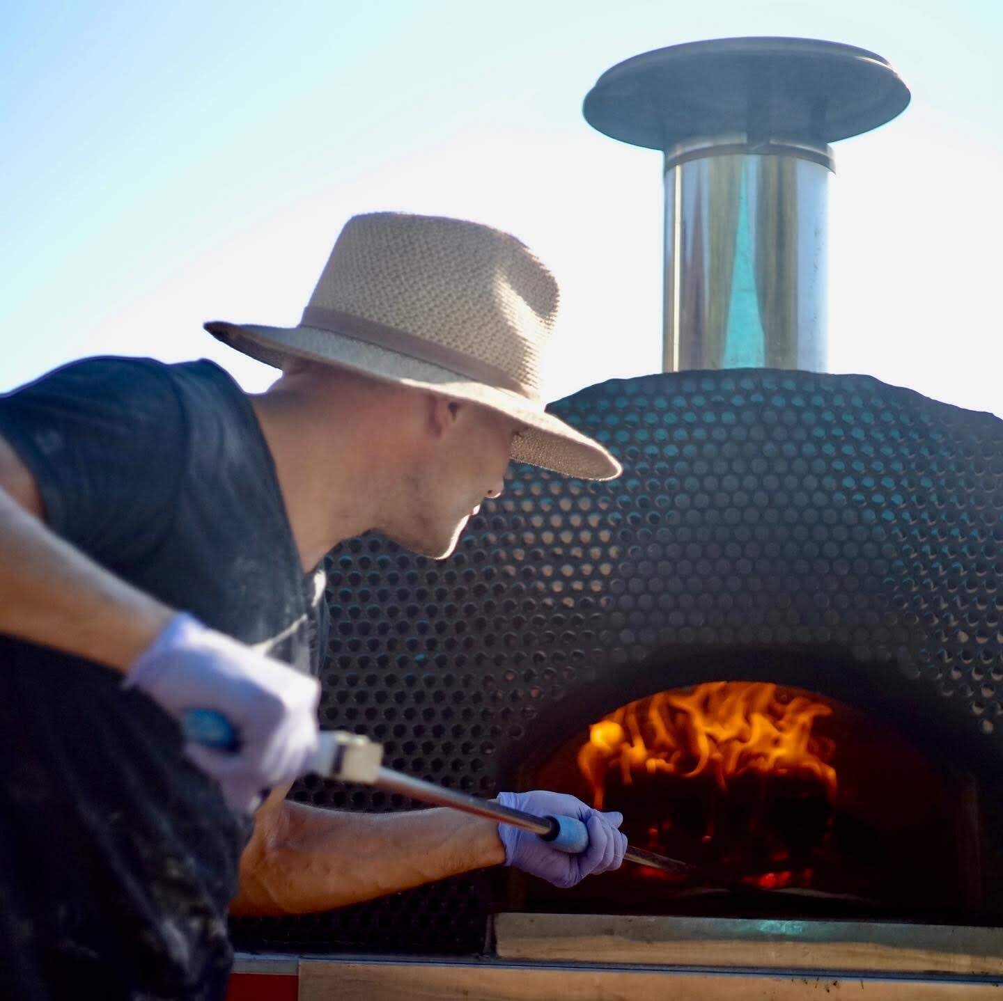 www.santabarawedding.com | Firefly Pizza Company | Putting the Pizzas in the Oven