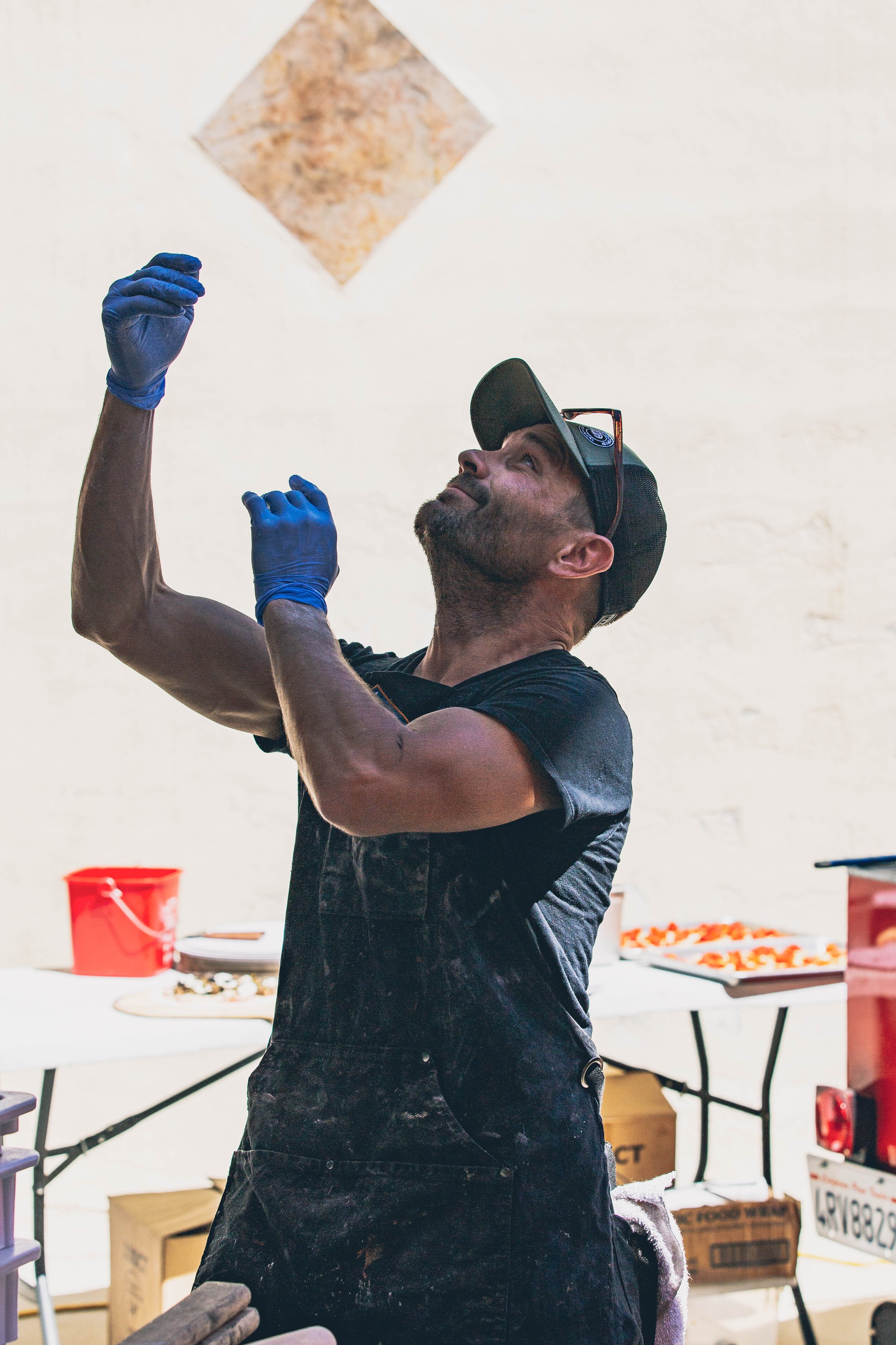 www.santabarawedding.com | Firefly Pizza Company | Tossing Pizza Dough in the Air