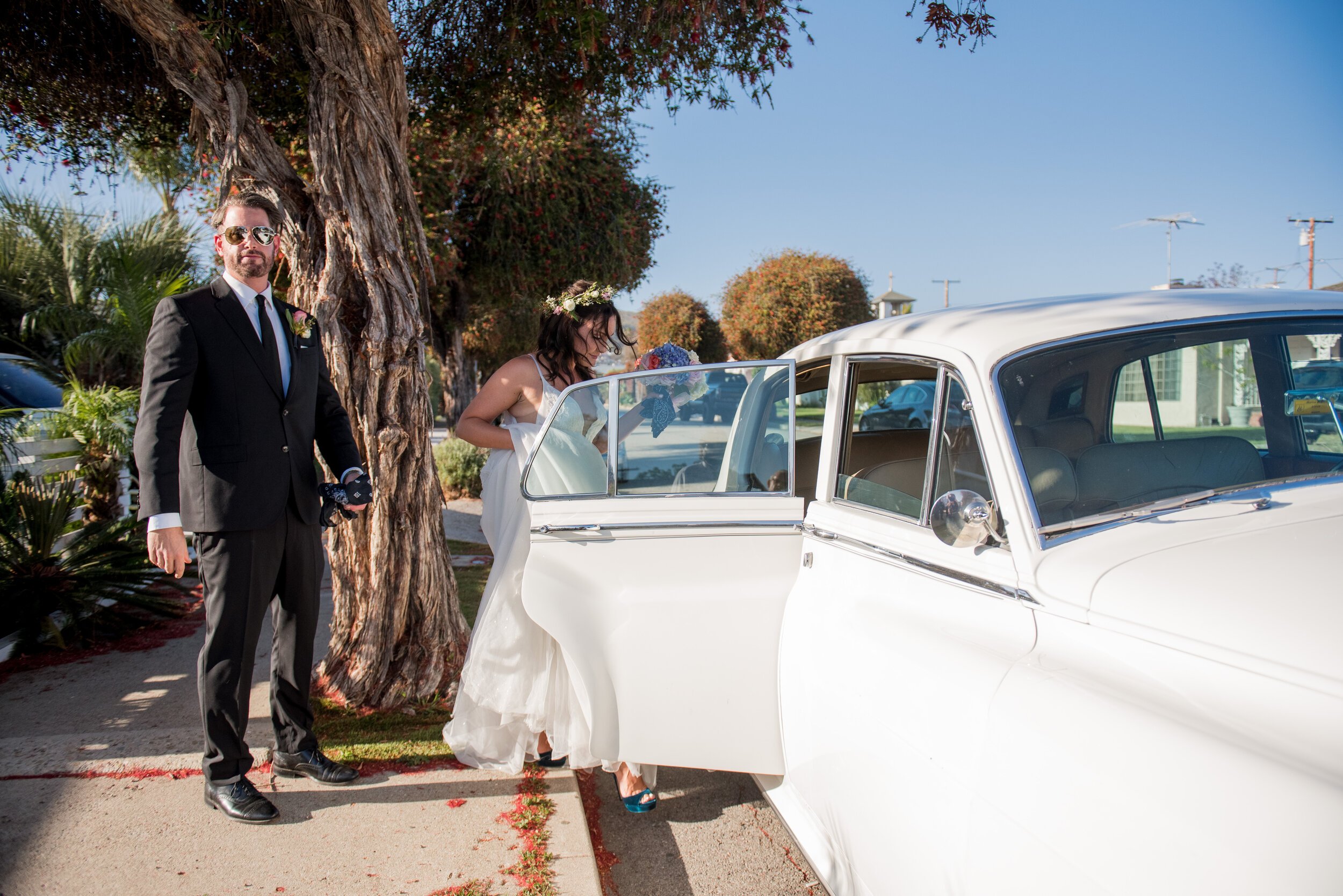 www.santabarbarawedding.com | ByCherry Photography | Santa Barbara Zoo | Events by Rincon | SB Hair &amp; Makeup | Classy Chassis | Bride and Groom Getting Into Their Rented Rolls Royce 