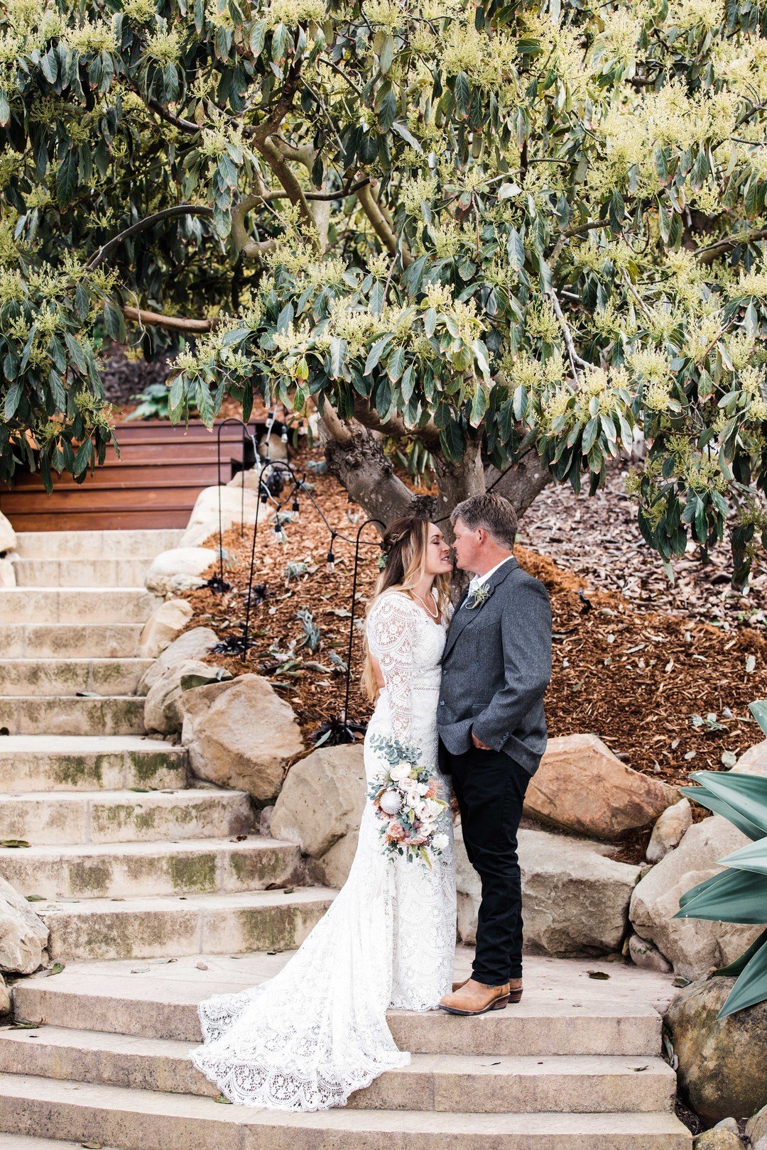 www.santabarbarawedding.com | Just Kiss Collective | Craddock Ranch | Alia Glasgow | Dulce Floral Design | Bride and Groom Share a Moment on the Stairs