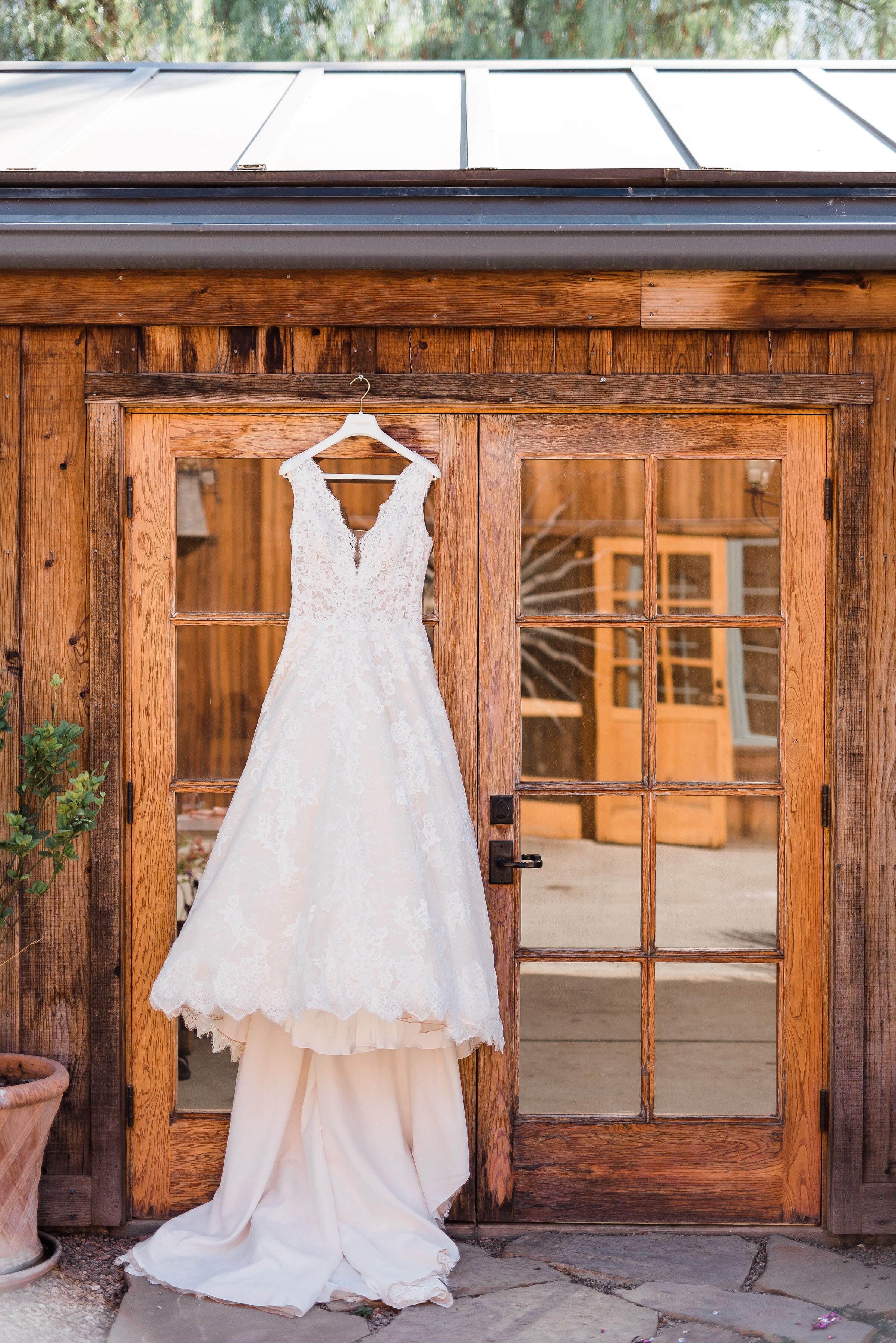 www.santabarbarawedding.com | Roblar Winery and Farm | Brittany Taylor Photography | Bride’s Wedding Gown Hanging from the Door