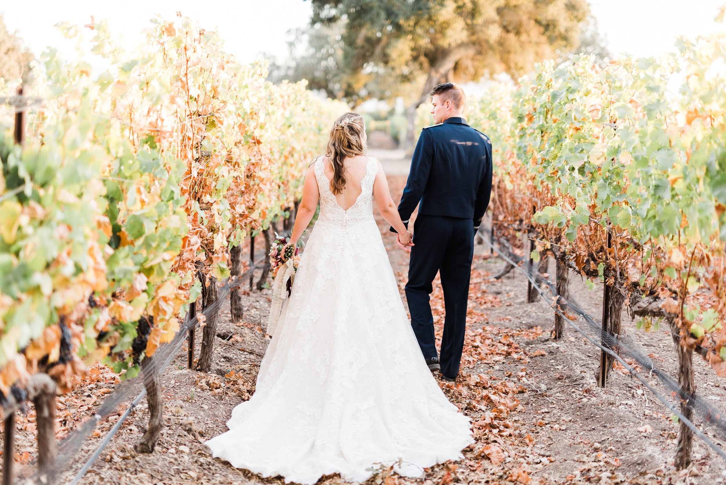 www.santabarbarawedding.com | Roblar Winery and Farm | Brittany Taylor Photography | Bride and Groom Stroll Through the Vineyard