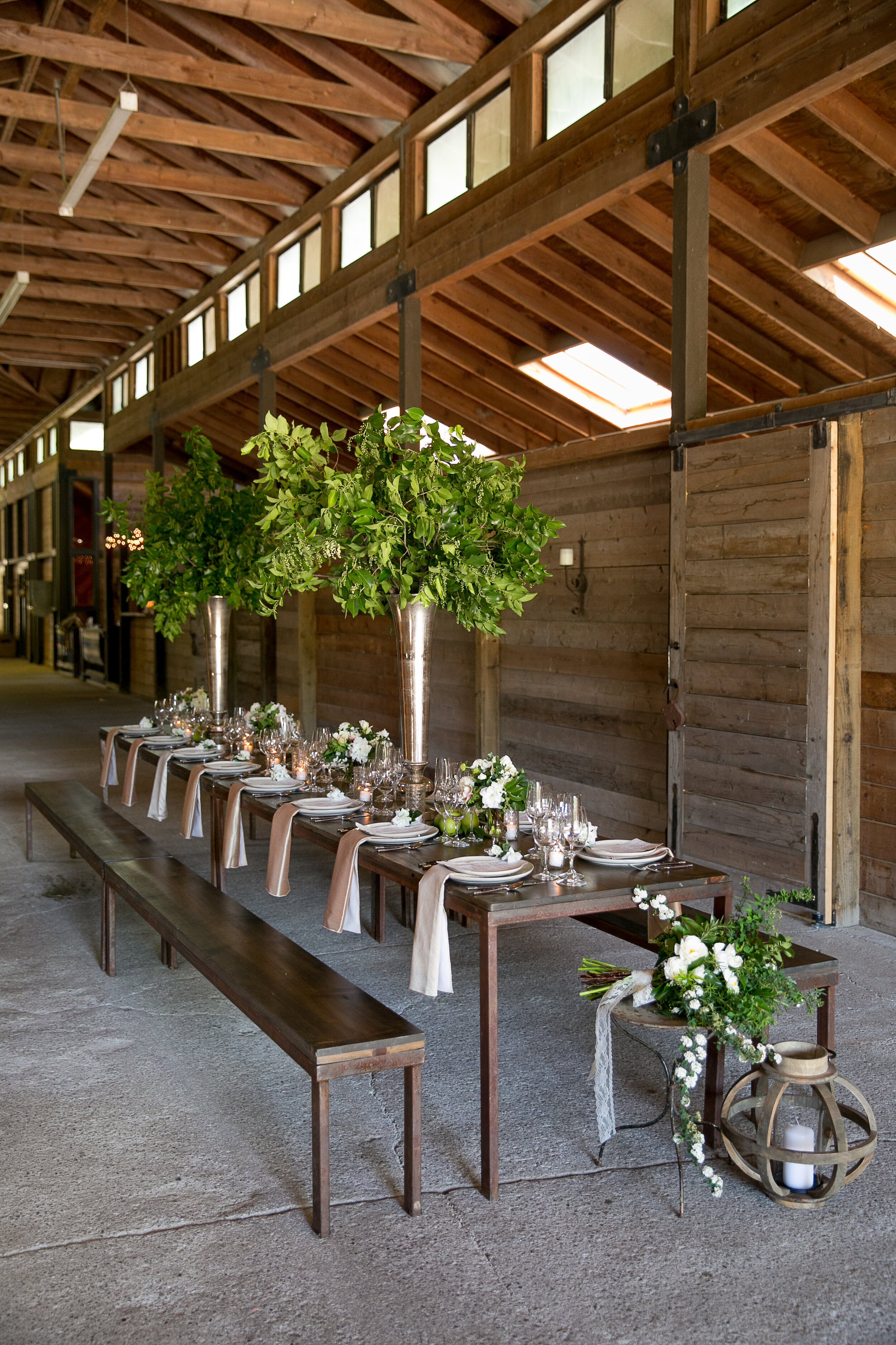 www.santabarbarawedding.com | Bright Event Rentals | Larissa Cleveland Photography | K2 Ranch | Wooden Reception Table with Greens