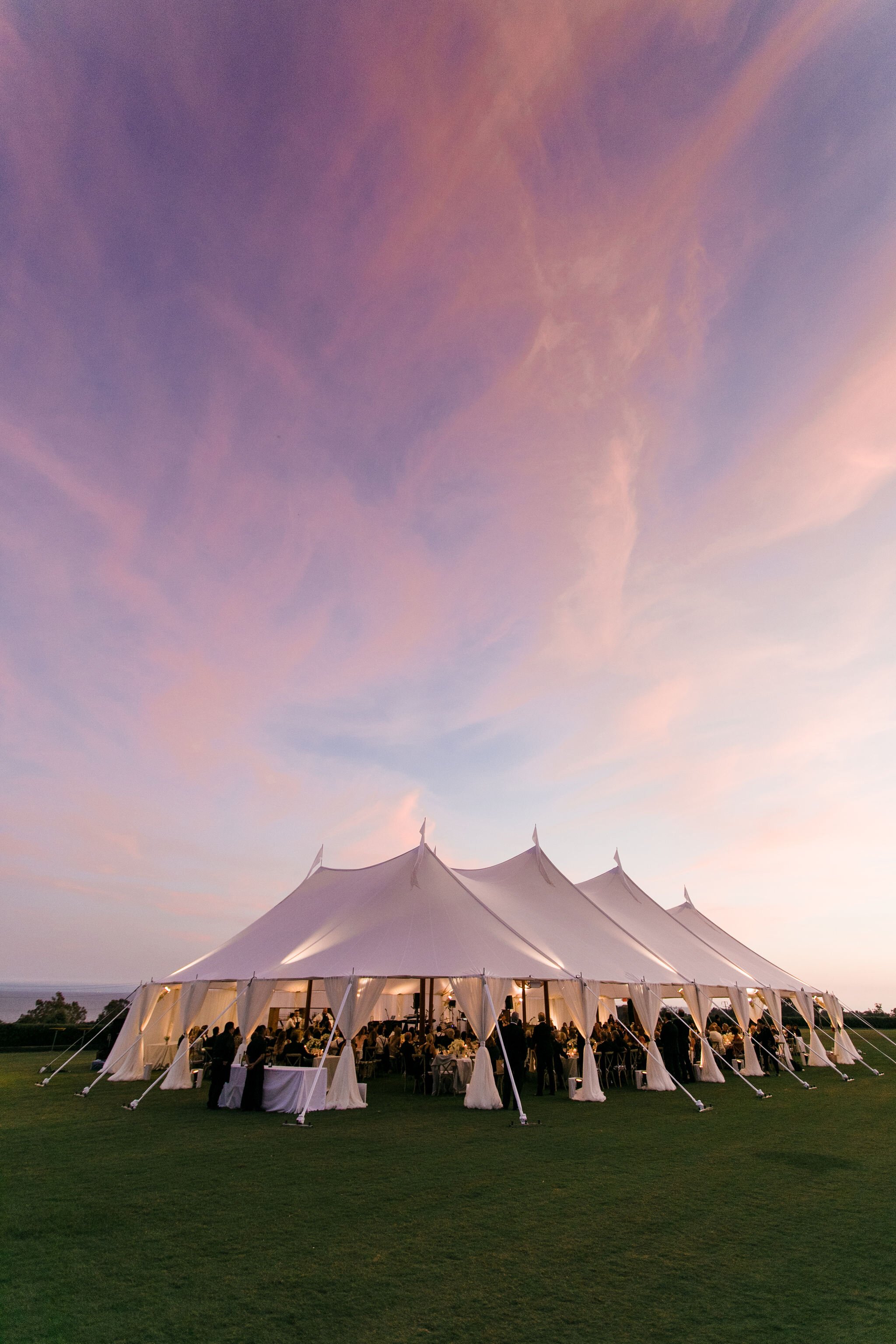 www.santabarbarawedding.com | Bright Event Rentals | Tidewater Klentner Ranch | Outdoor Reception Under a Tent at Sunset