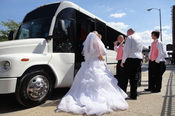 www.santabarbarawedding.com | Santa Barbara Limos | Bride and Groom Get on the White Wedding Bus