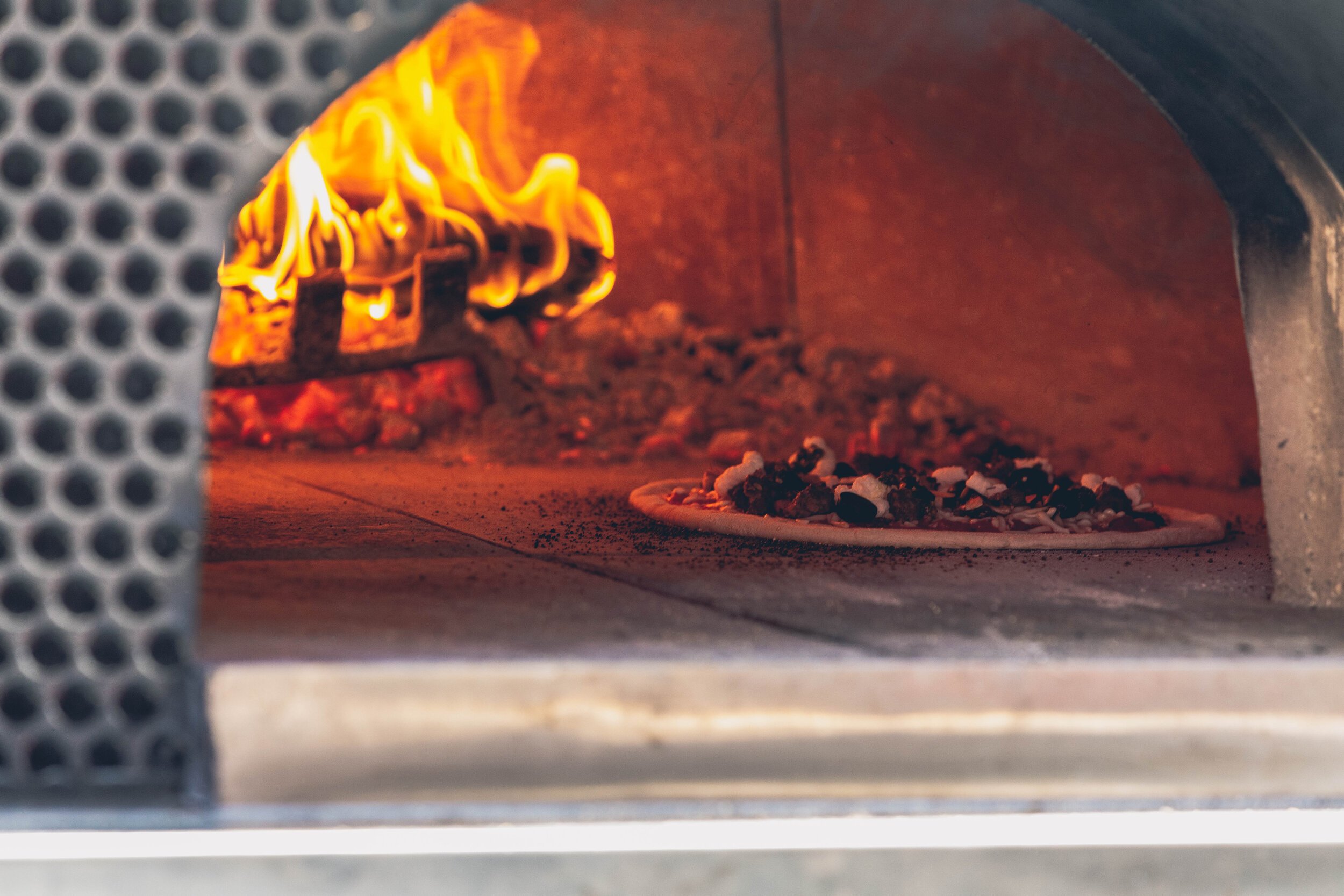 www.santabarbarawedding.com | Firefly Pizza Company | Pizza Baking in the Oven