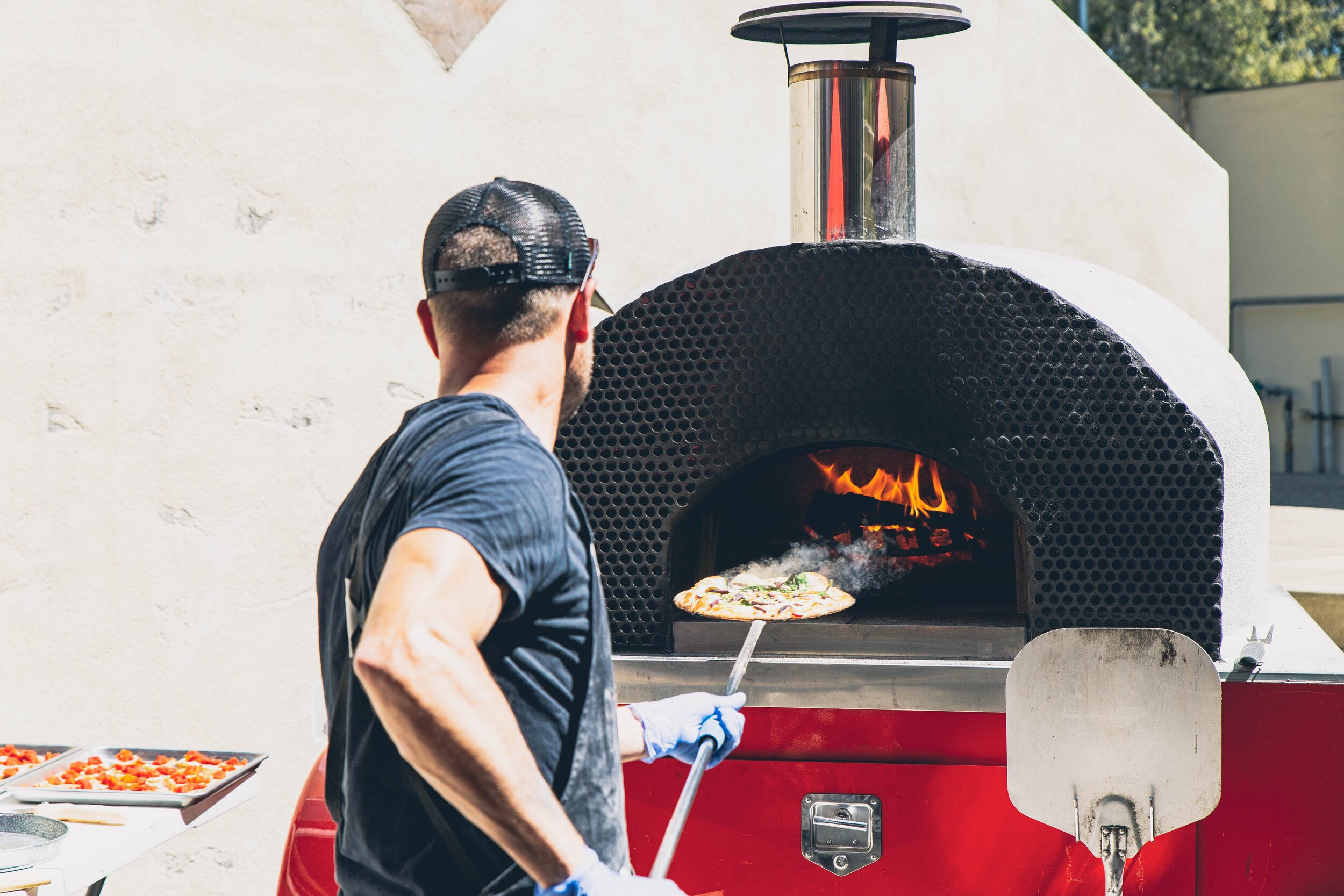 www.santabarbarawedding.com | Firefly Pizza Company | Taking Pizza Out of the Oven