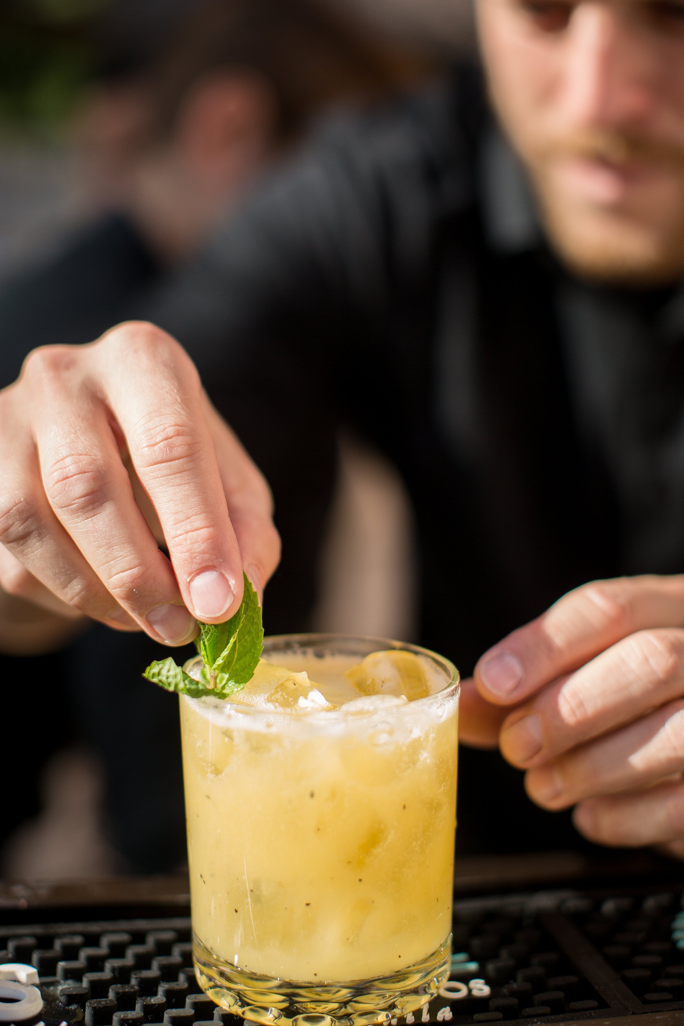 www.santabarbarawedding.com | Flair Project | Bartender Adding Mint to the Edge of a Glass