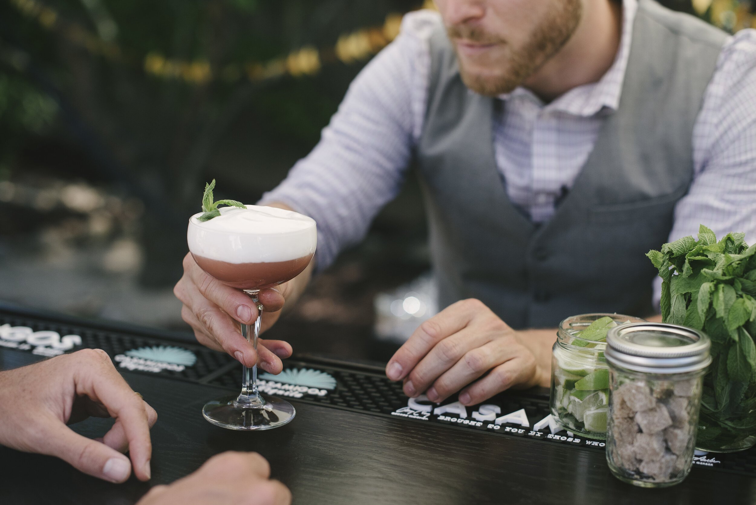 www.santabarbarawedding.com | Flair Project | Bartender Serving a Cocktail
