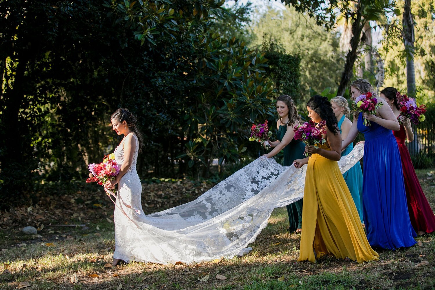www.santabarbarawedding.com | Nightingale Photography | Rancho Dos Pueblos | Wild Hearts Events | TEAM Hair &amp; Makeup | Knot Just Flowers | Bridesmaids Carrying Bride’s Dress Train