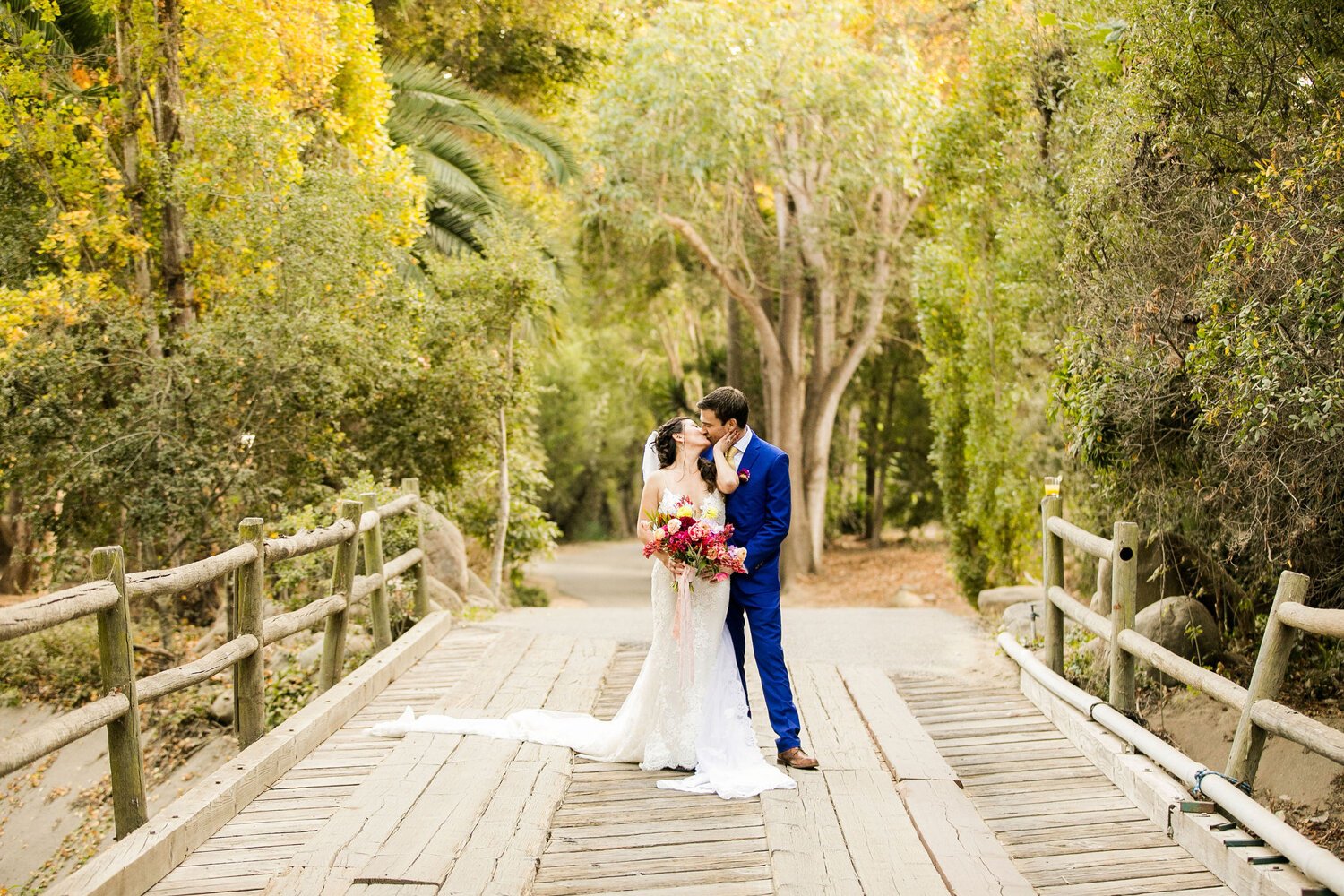 www.santabarbarawedding.com | Nightingale Photography | Rancho Dos Pueblos | Wild Hearts Events | Knot Just Flowers | TEAM Hair &amp; Makeup | Bride and Groom Kiss Among the Trees