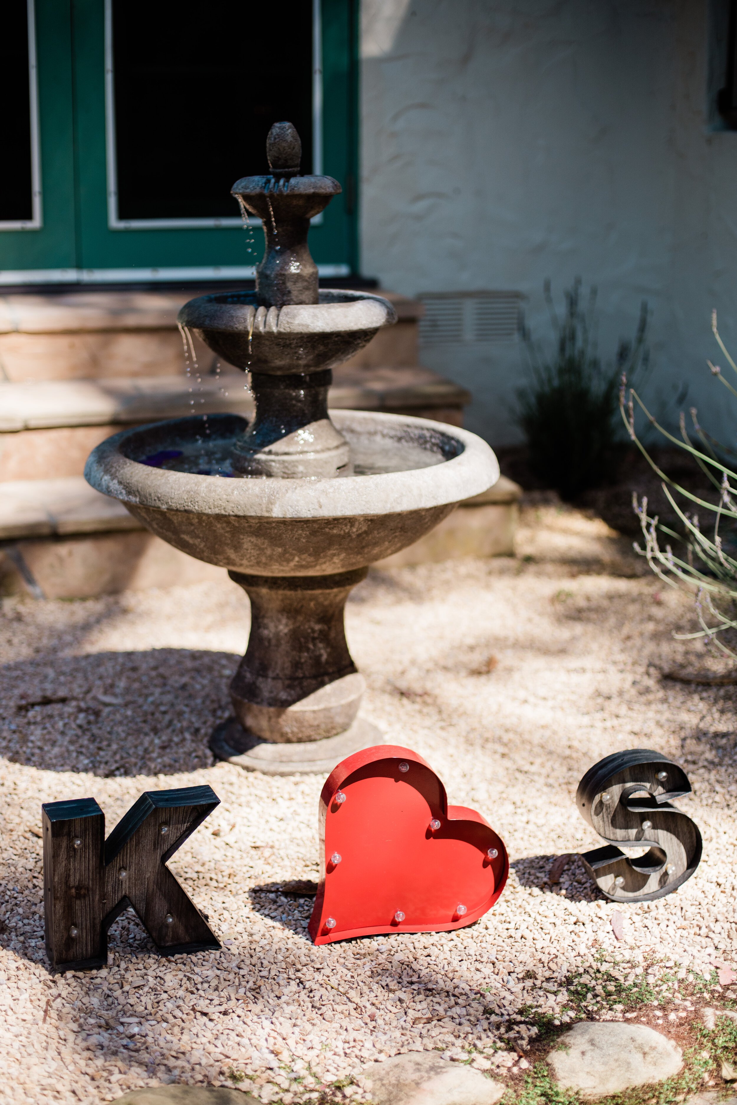 www.santabarbarawedding.com | ByCherry Photography | Riviera Productions | Couple’s Initials Signs by Fountain
