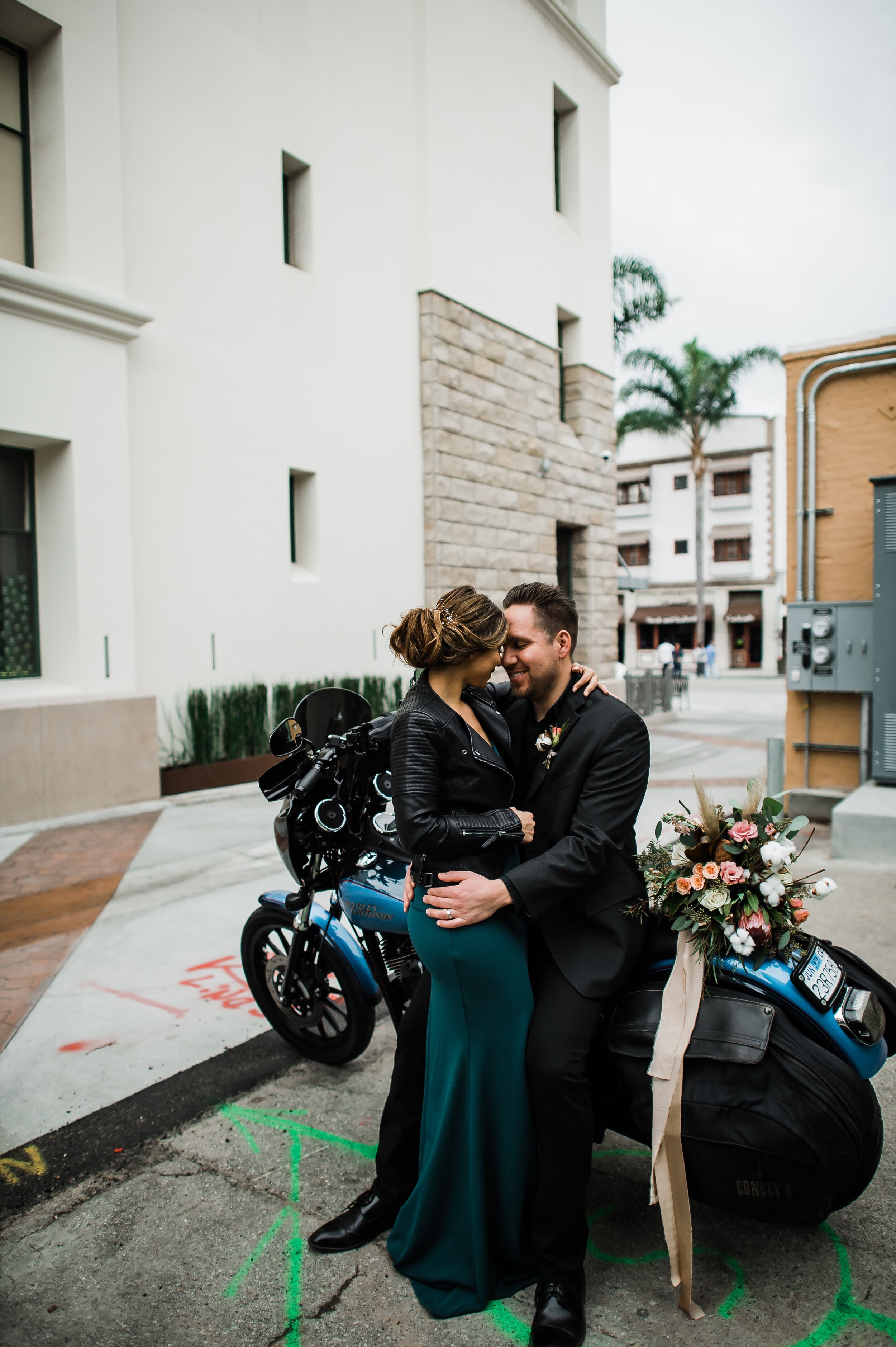 www.santabarbarawedding.com | Cafe Fiore | Michelle Ramirez | Simply S Events | Tangled Lotus | Jos A. Bank | Windsor | Honey Silks Co. | Bride and Groom Kiss by a Motorcycle
