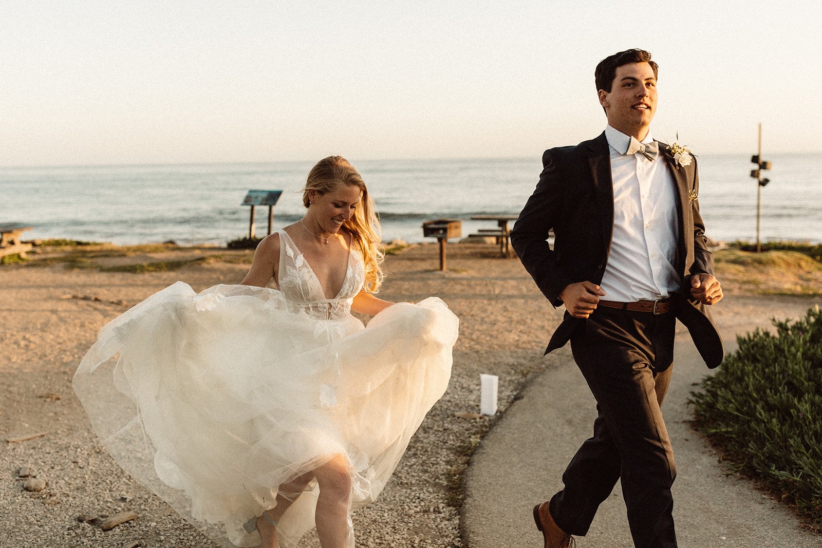 www.santabarbarawedding.com | Isabella Griffith Photography | El Capitan State Beach | KB Events | Couple Runs Off the Beach