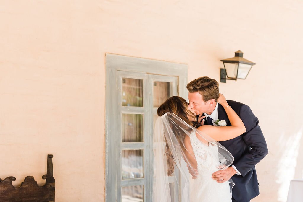 www.santabarbarawedding.com | SB Historical Museum | Donna Romani | Julie Shuford Photography | Beauty by Cherise | Krysta Withrow | Alexis Ireland Florals | Couple Shares a Kiss