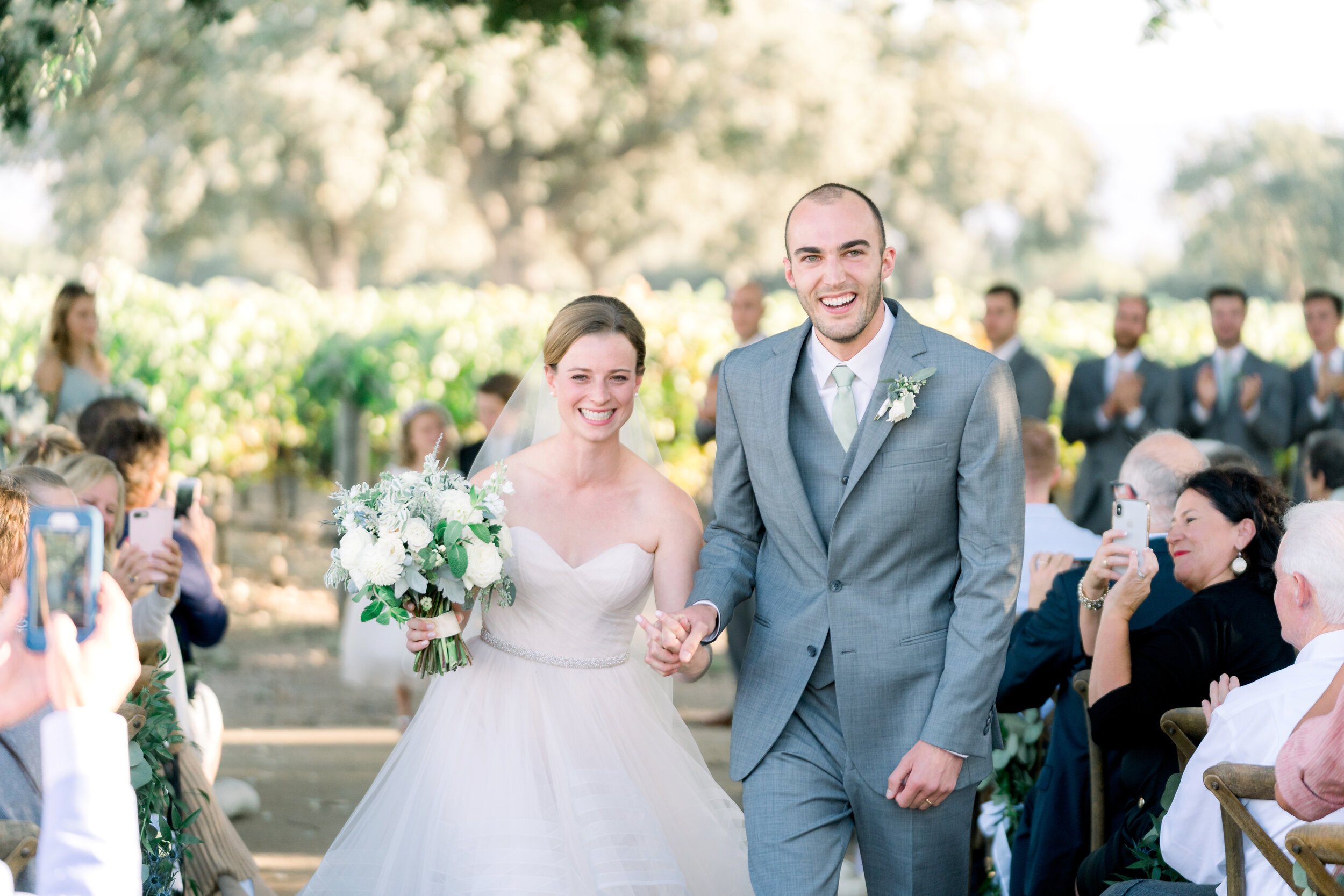 www.santabarbarawedding.com | We Heart Photography | Roblar Winery | Elizabeth Ginder Events | Alexis Ireland Florals | Camaille Victoria | Mishay Salon | Bride and Groom Leave the Ceremony