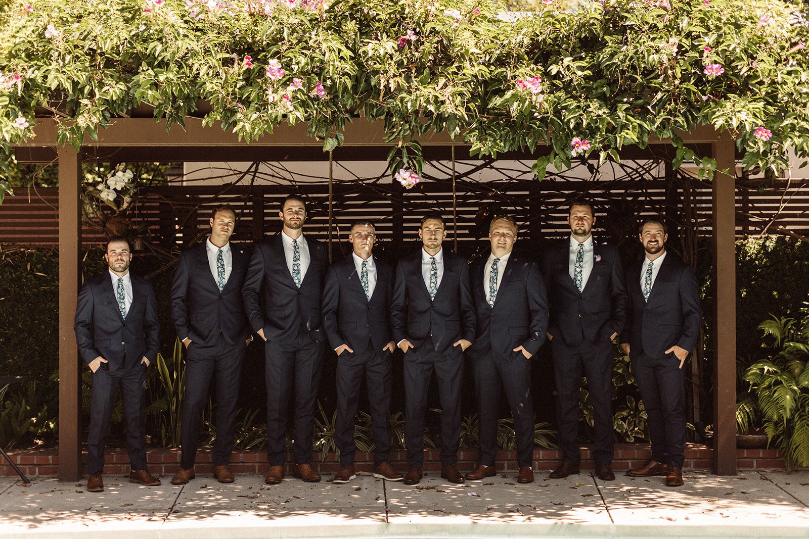 www.santabarbarawedding.com | Isabella Griffith Photography | Santa Barbara Club | Fern &amp; Foxtail | groomsmen navy blue suits with floral ties