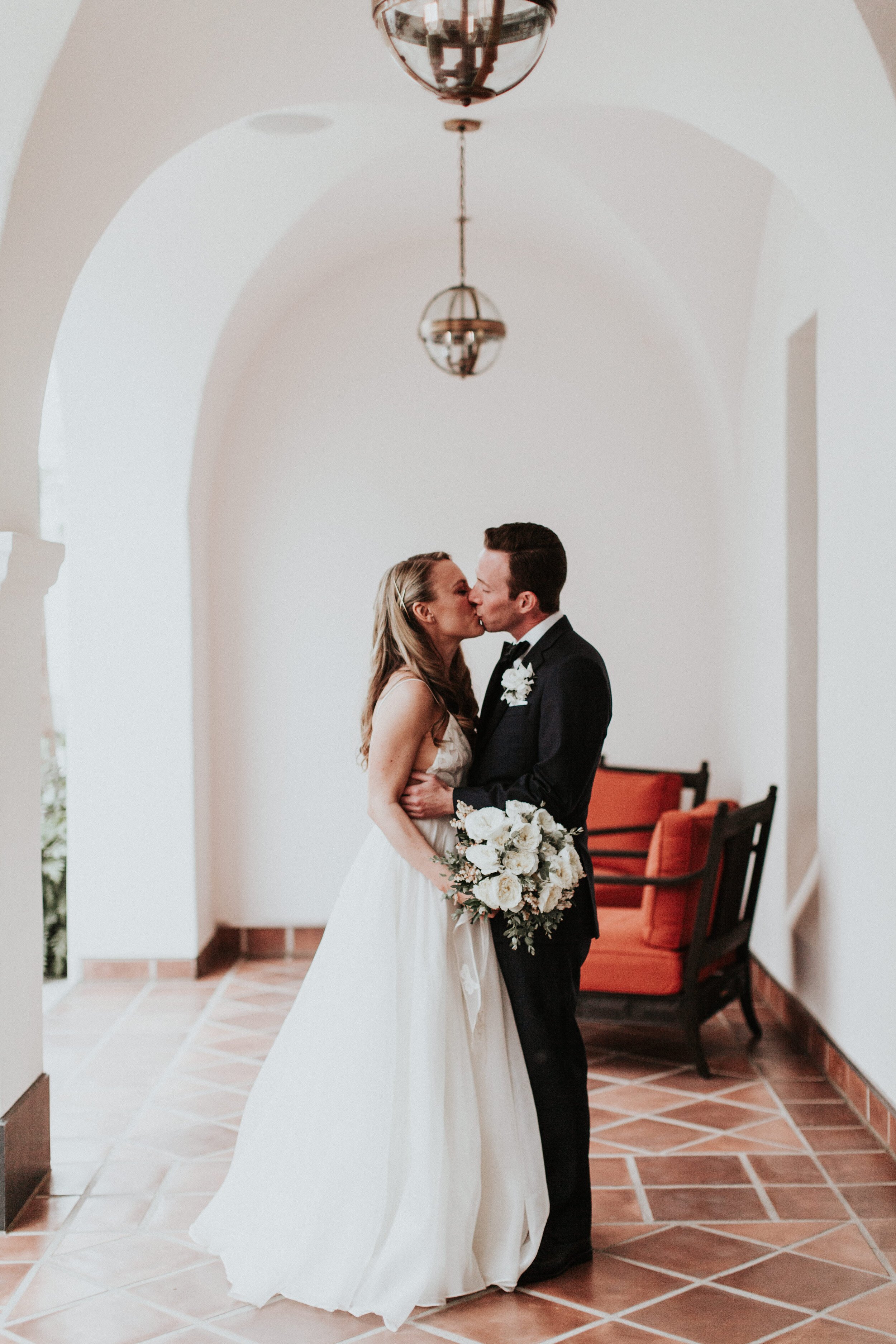 www.santabarbarawedding.com | Santa Barbara Zoo | XOXO Weddings | Alexandra Wallace | Louloudi Design | Sarah Seven | Bride and Groom Share a Kiss