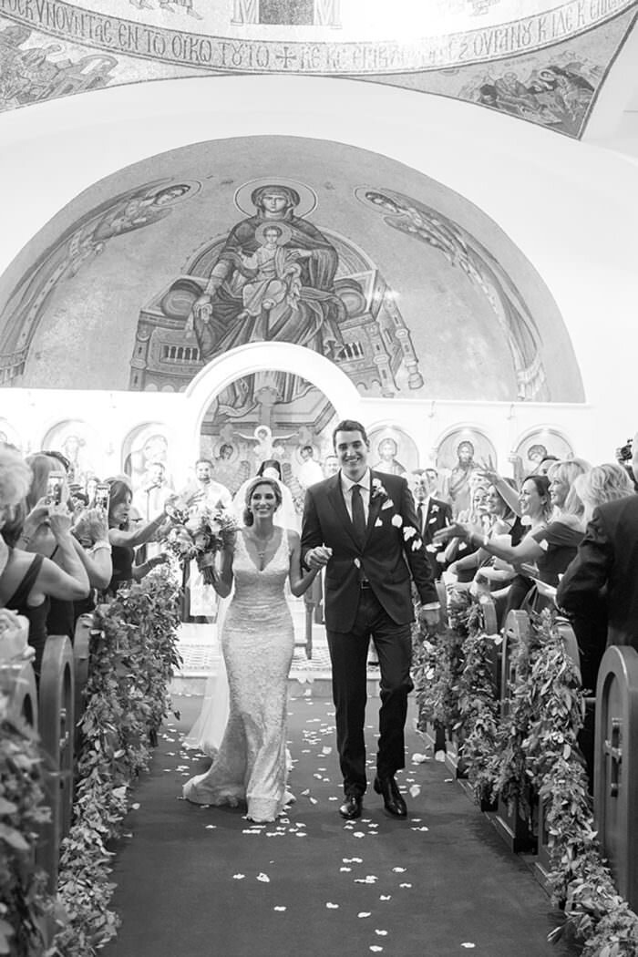 www.santabarbarawedding.com | Kristen Beinke Photography | Santa Barbara Greek Orthodox Church | Alexandra Kolendrianos | Precious &amp; Blooming | Bride and Groom Leaving Ceremony 