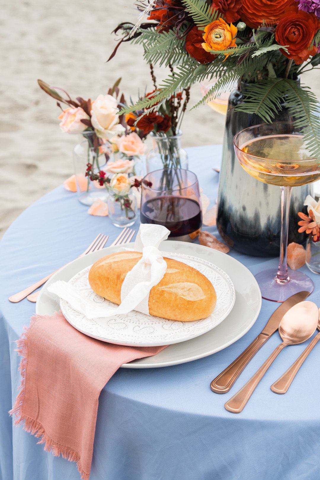 www.santabarbaraweddings.com | Staci &amp; Michael Photography | Hearst Beach | Mauna Florist | Linens: Pier 1 Imports | Decor: World Market | Reception Table