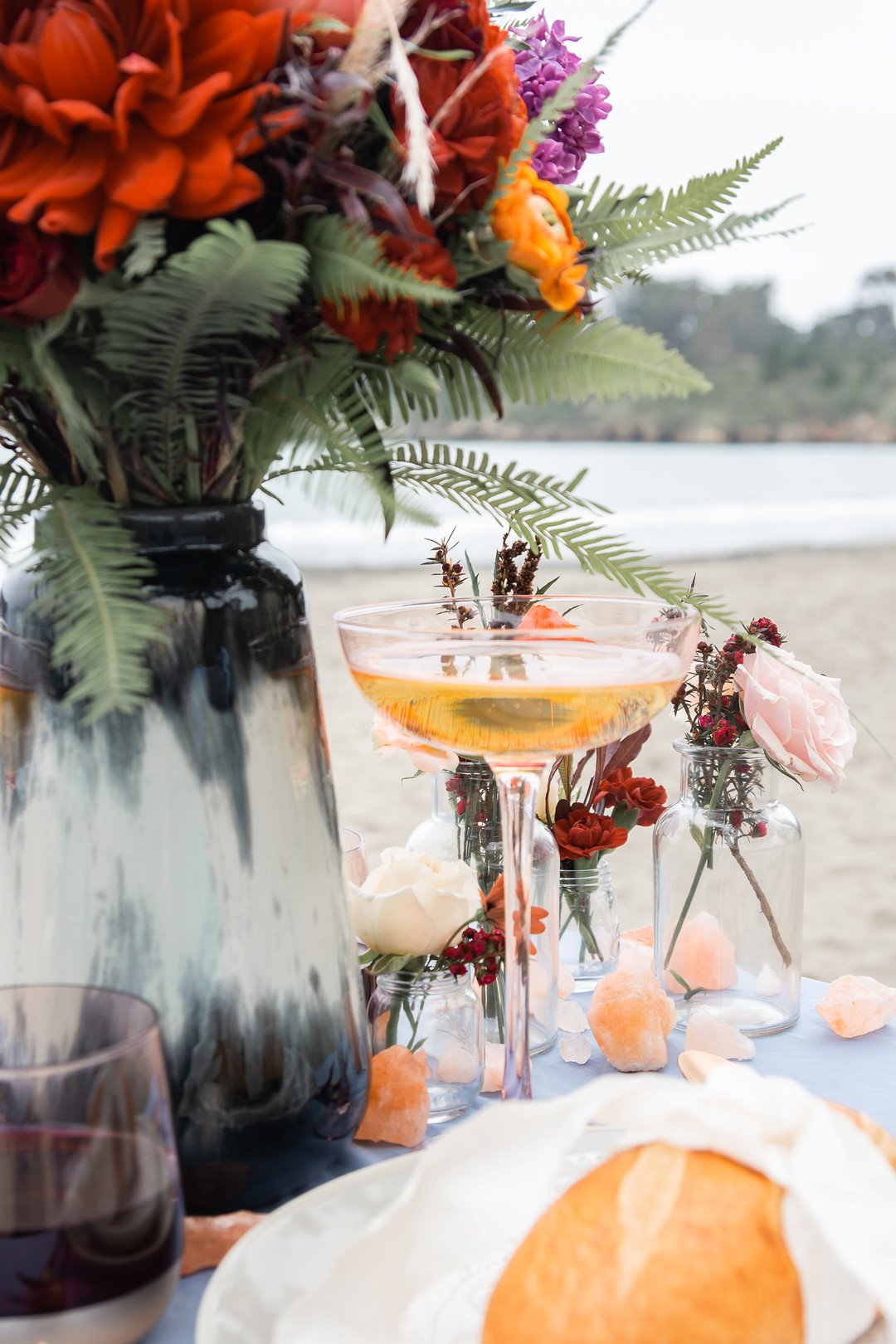 www.santabarbaraweddings.com | Staci &amp; Michael Photography | Hearst Beach | Mauna Florist | Linens: Pier 1 Imports | Decor: World Market | Reception Table