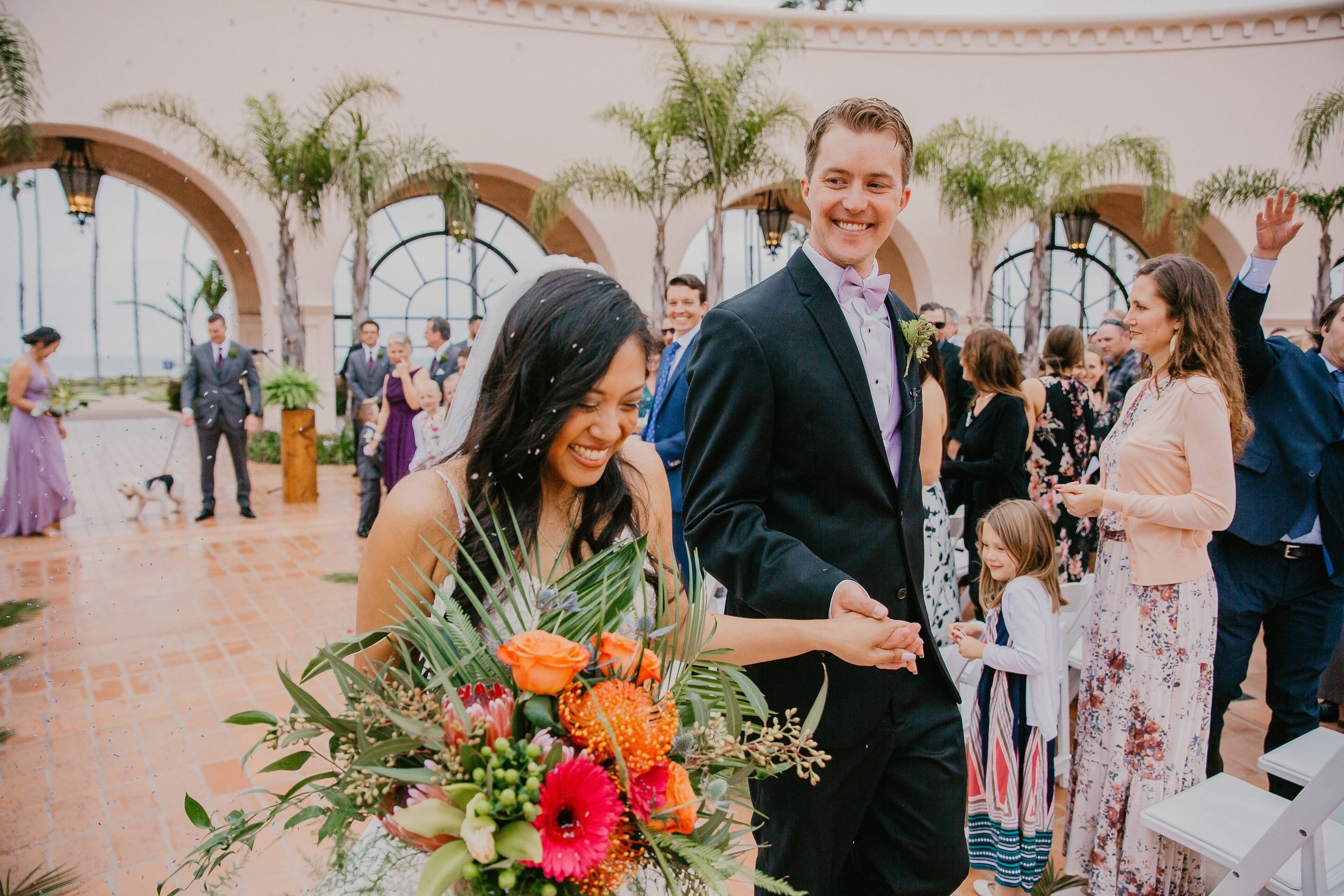 www.santabarbarawedding.com | Candice Marie Photography | Hilton Santa Barbara Beachfront Resort | Dalina Klan | Once in a Lifetime Weddings | Alpha Floral | Bride and Groom Leaving Ceremony