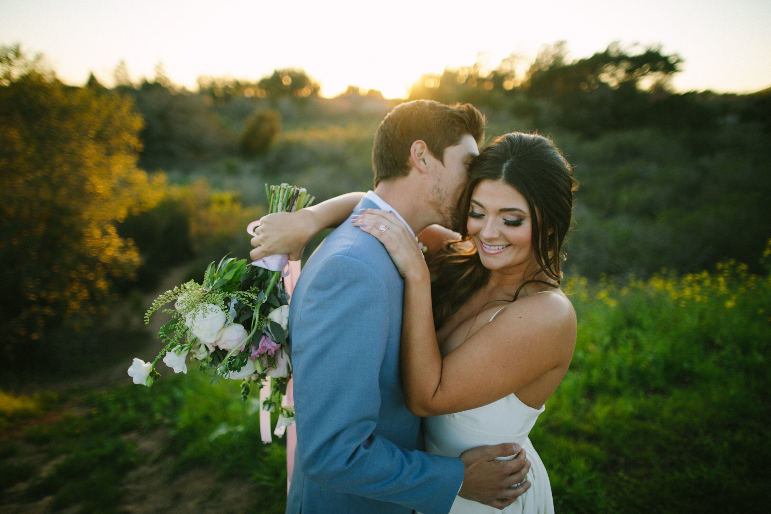 www.santabarbarawedding.com | Photographer: Patrick Ang | Venue: Rancho La Patera &amp; Stow House | Wedding Planner: Elyse Rowen of Elyse Events | Bride and Groom Bouquet and Kiss