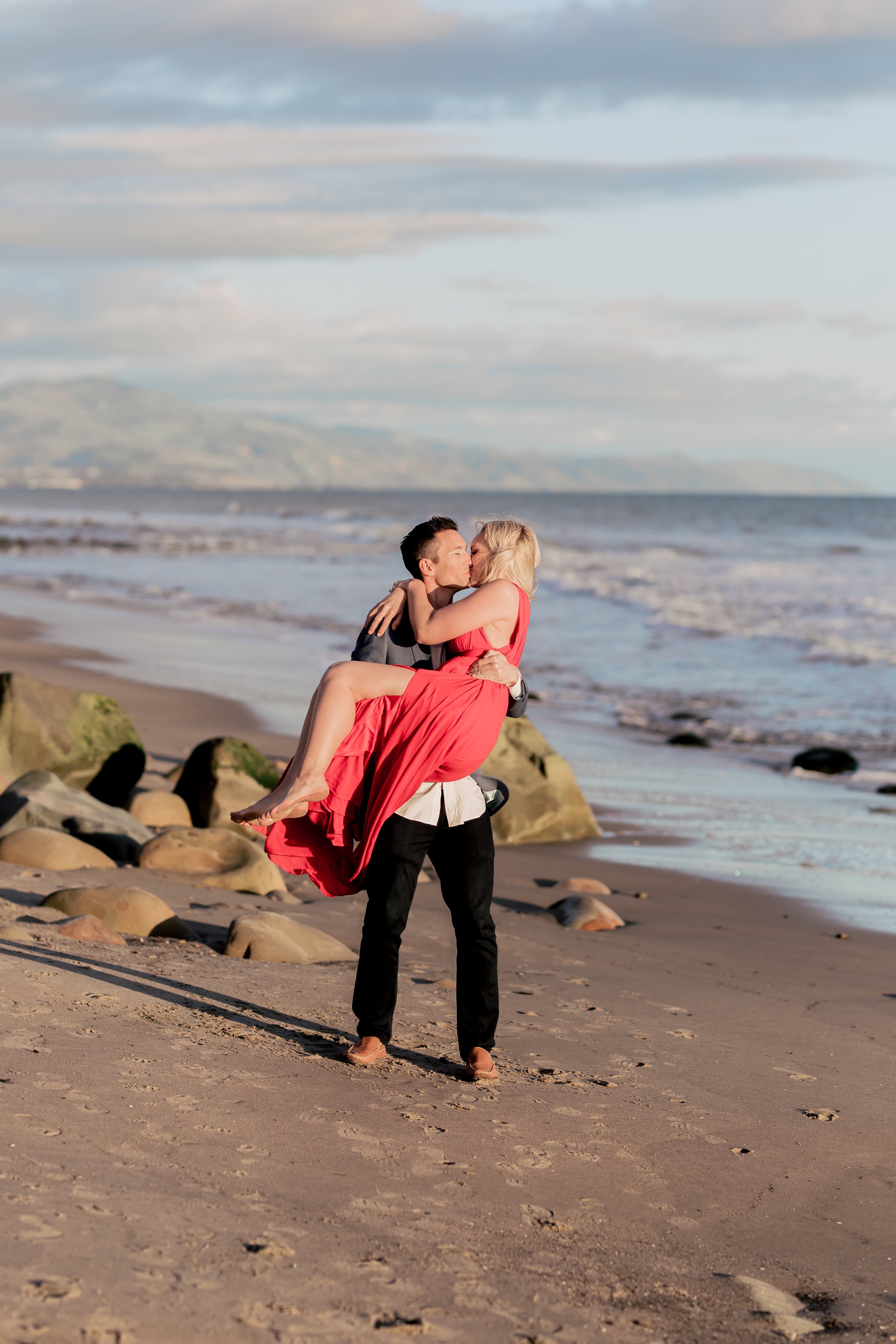 santabarbarawedding.com | Rewind Photography | Butterfly Beach | Engaged Couple on Beach at Sunset