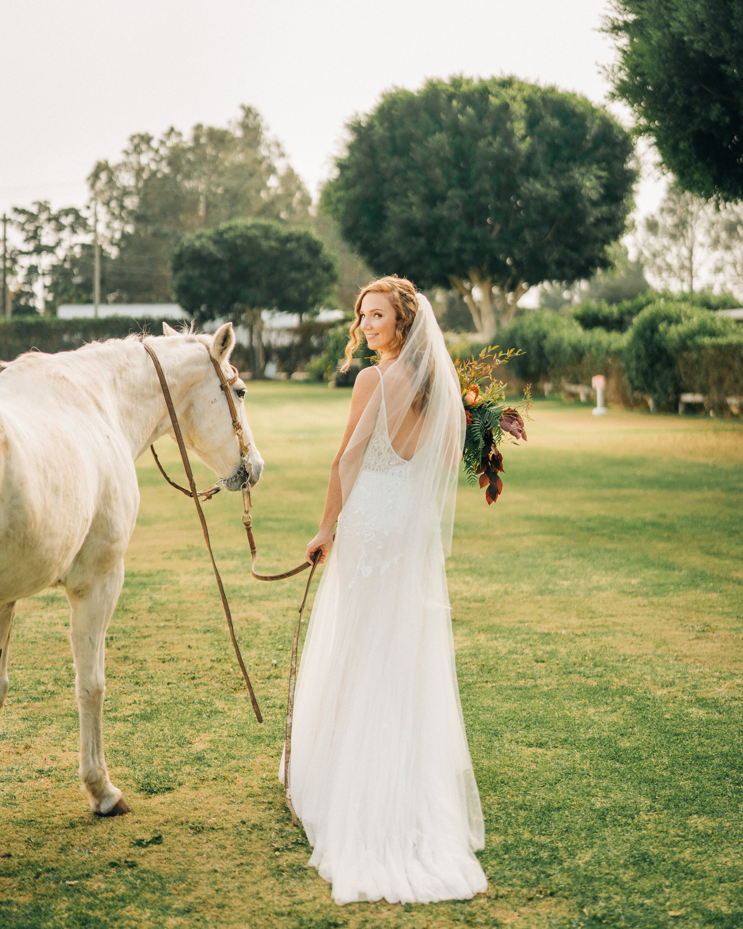 www.santabarbarawedding.com | Brandon Bibbins Photography | The Cottages at Polo Run | Lucy Salgado | Bride Leads Horse
