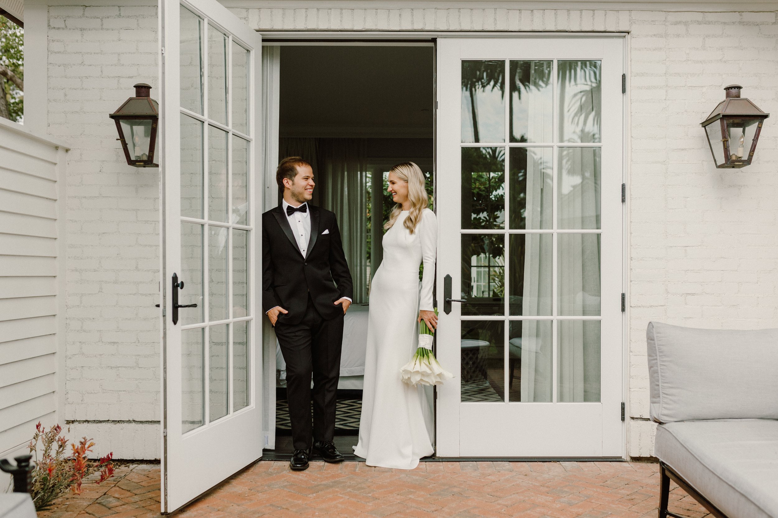 www.santabarbarawedding.com | Nicole Donnelly | Rosewood Miramar Beach | Alpha Floral | BHLDN | On Location Hair &amp; Makeup | Bride and Groom in the Doorway