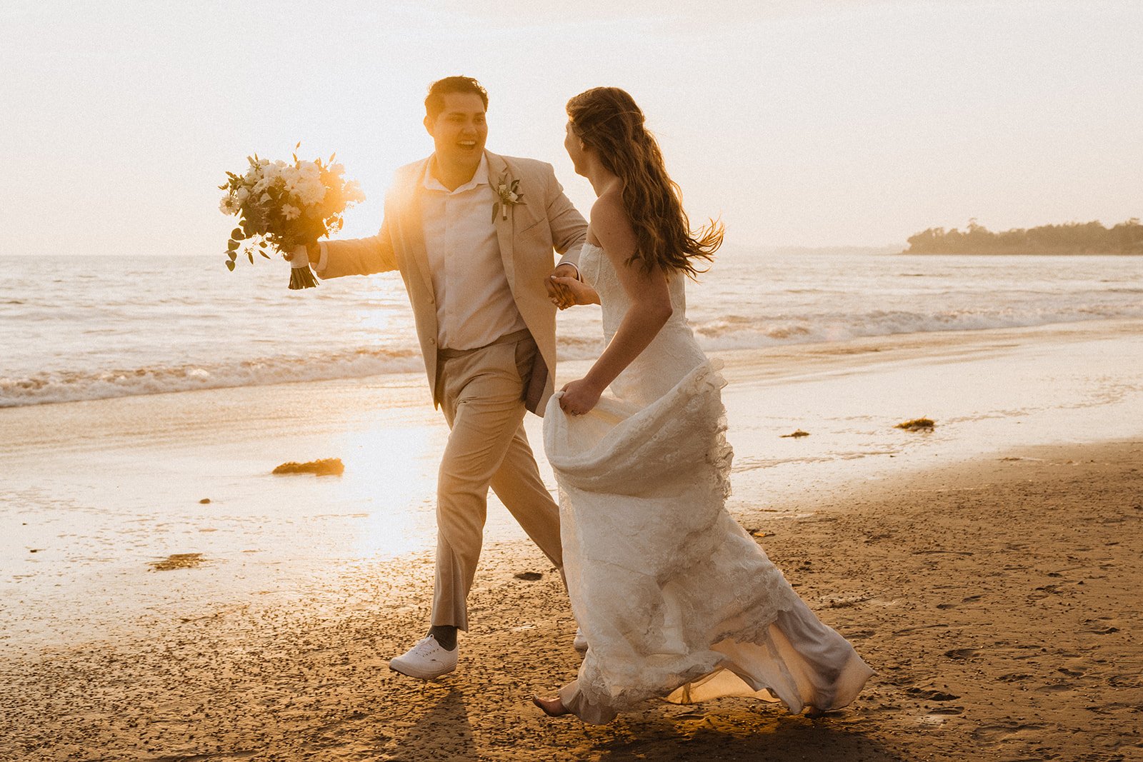 www.santabarbarawedding.com | Cait Photo | Rincon Beach Club | Talia Eliana Events | The Twisted Twig | Theia Bridal | Friar Tux | Couple Running on the Beach