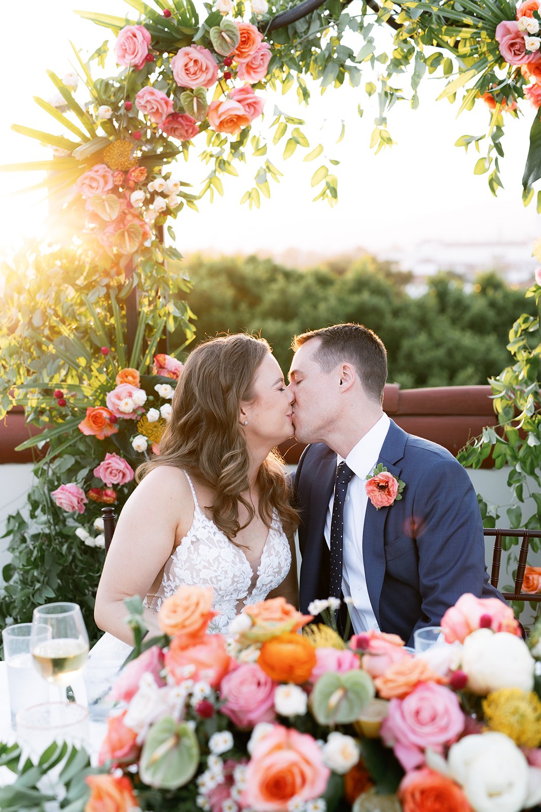 www.santabarbarawedding.com | Kimpton Canary | Ann Johnson Events | Anna Delores | Ella &amp; Louie | Scott Topper Productions | Couple Kissing At Their Sweetheart Table