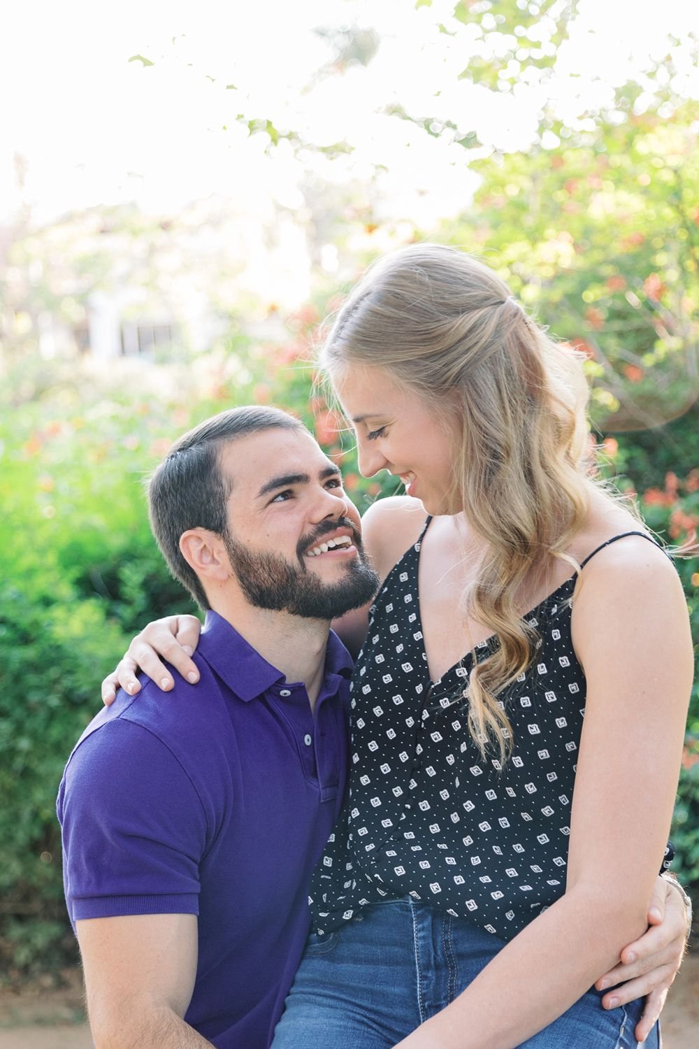 www.santabarbarawedding.com | Renoda Campbell Photography | Couple Sitting on Bench at Santa Barbara Engagement Shoot