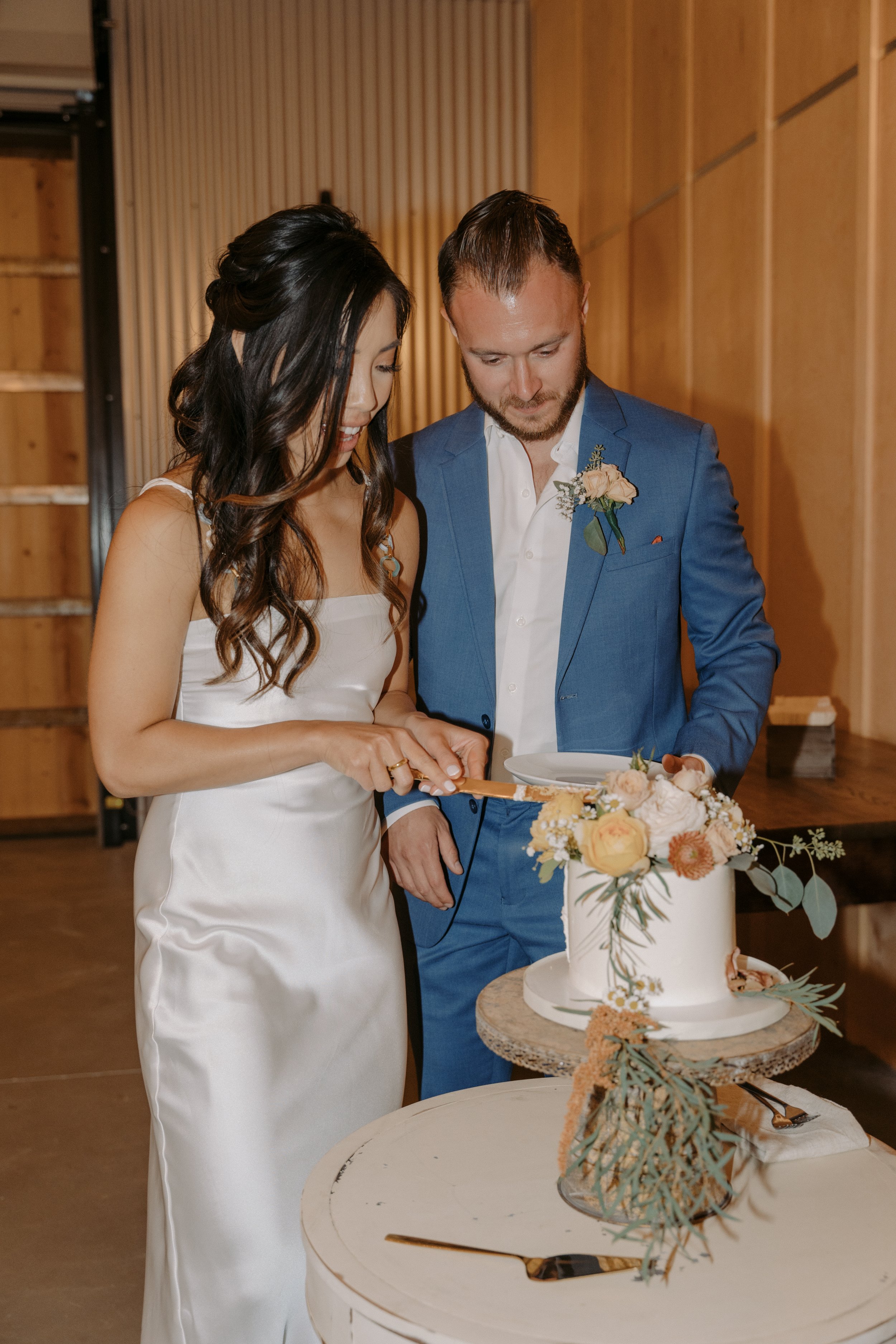  www.santabarbarawedding.com | Events by Fran | Ali Beck | Ecomama Farms | Jackie Romero | Solvang Bakery | Bride and Groom Cutting the Cake 