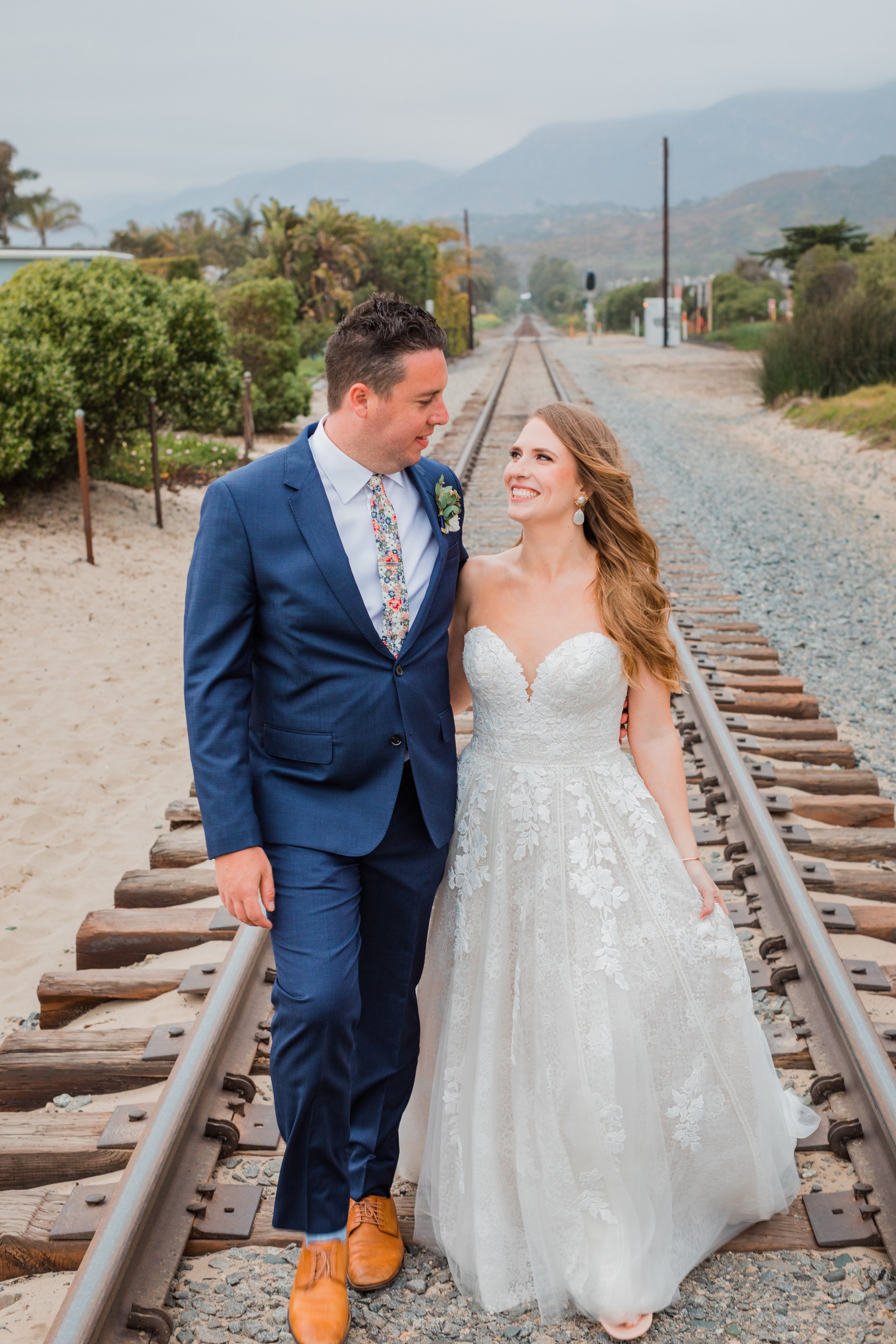 www.santabarbarawedding.com | Wonder Tribe | Talia Eliana Events | Events by Rincon | Santa Claus Beach | Black Tux | Essense of Australia | The Twisted Twig | Couple on Railroad Tracks