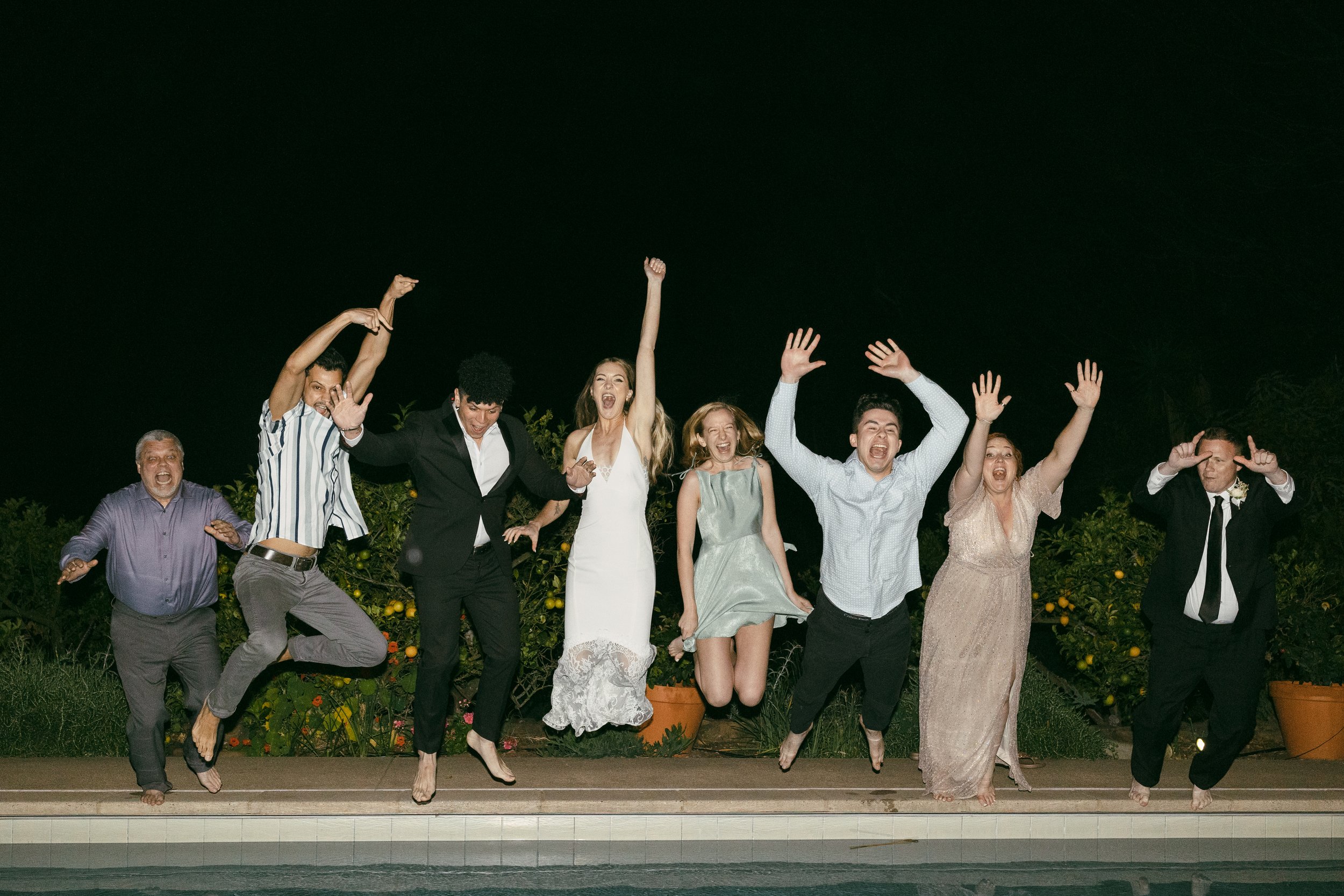 www.santabarbarawedding.com | Taylor Stuck Photography | Santa Barbara Courthouse | Fleur De Rye | ASOS | Brides for a Cause | Eryka De Santi | Couple and Guest Jumping