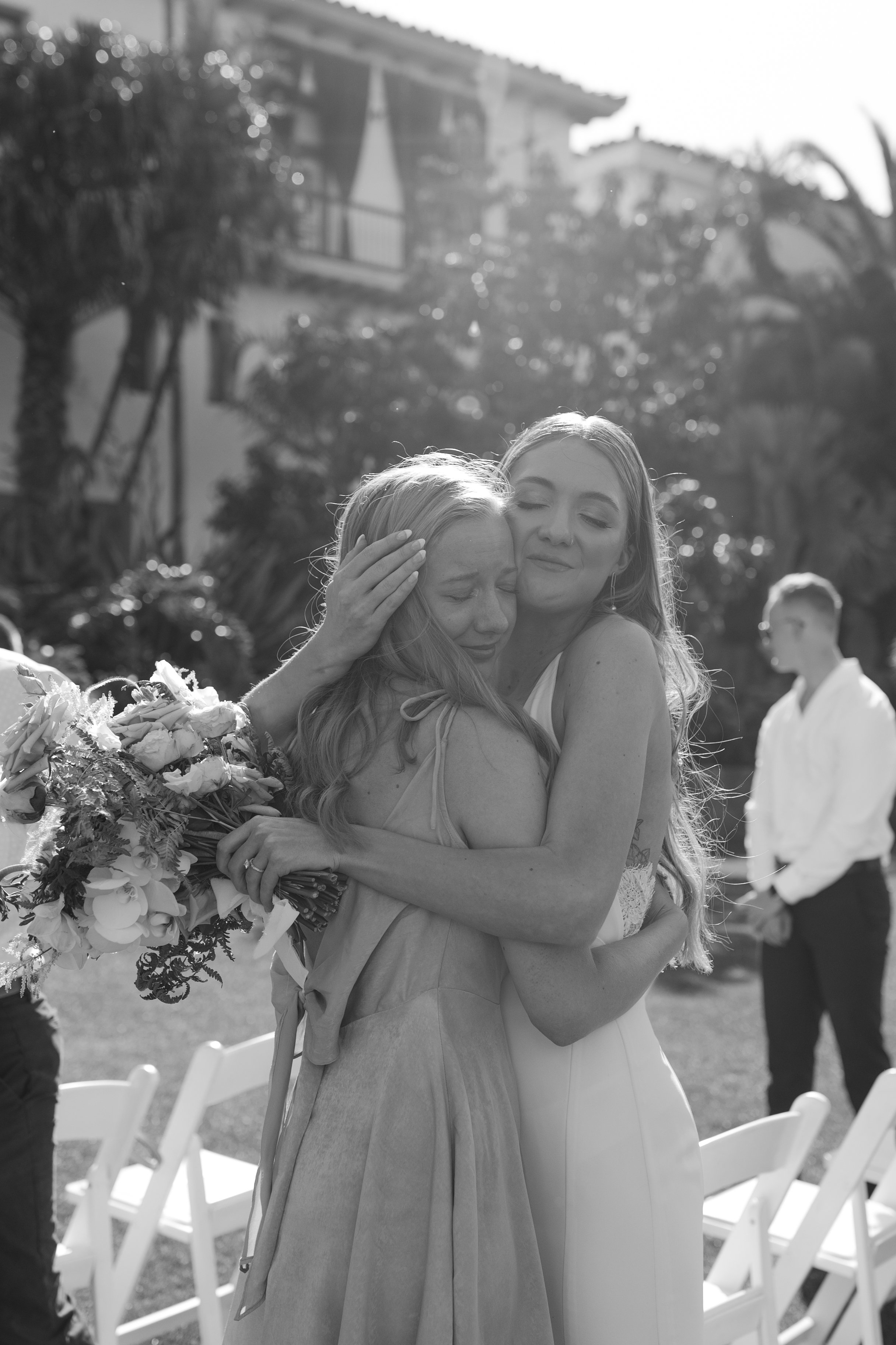 www.santabarbarawedding.com | Taylor Stuck Photography | Santa Barbara Courthouse | Fleur De Rye | Brides for a Cause | Eryka De Santi | Bride Hugging Bridesmaid