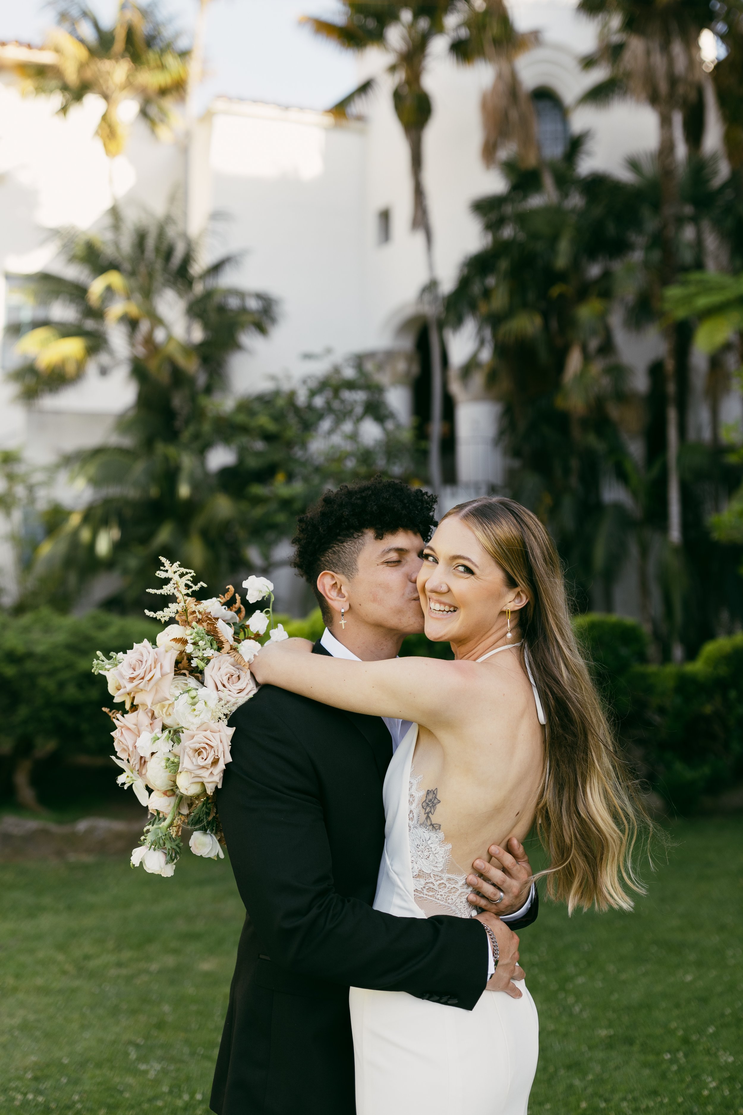 www.santabarbarawedding.com | Taylor Stuck Photography | Santa Barbara Courthouse | Fleur De Rye | Brides for a Cause | Eryka De Santi | ASOS | Bride and Groom Embracing