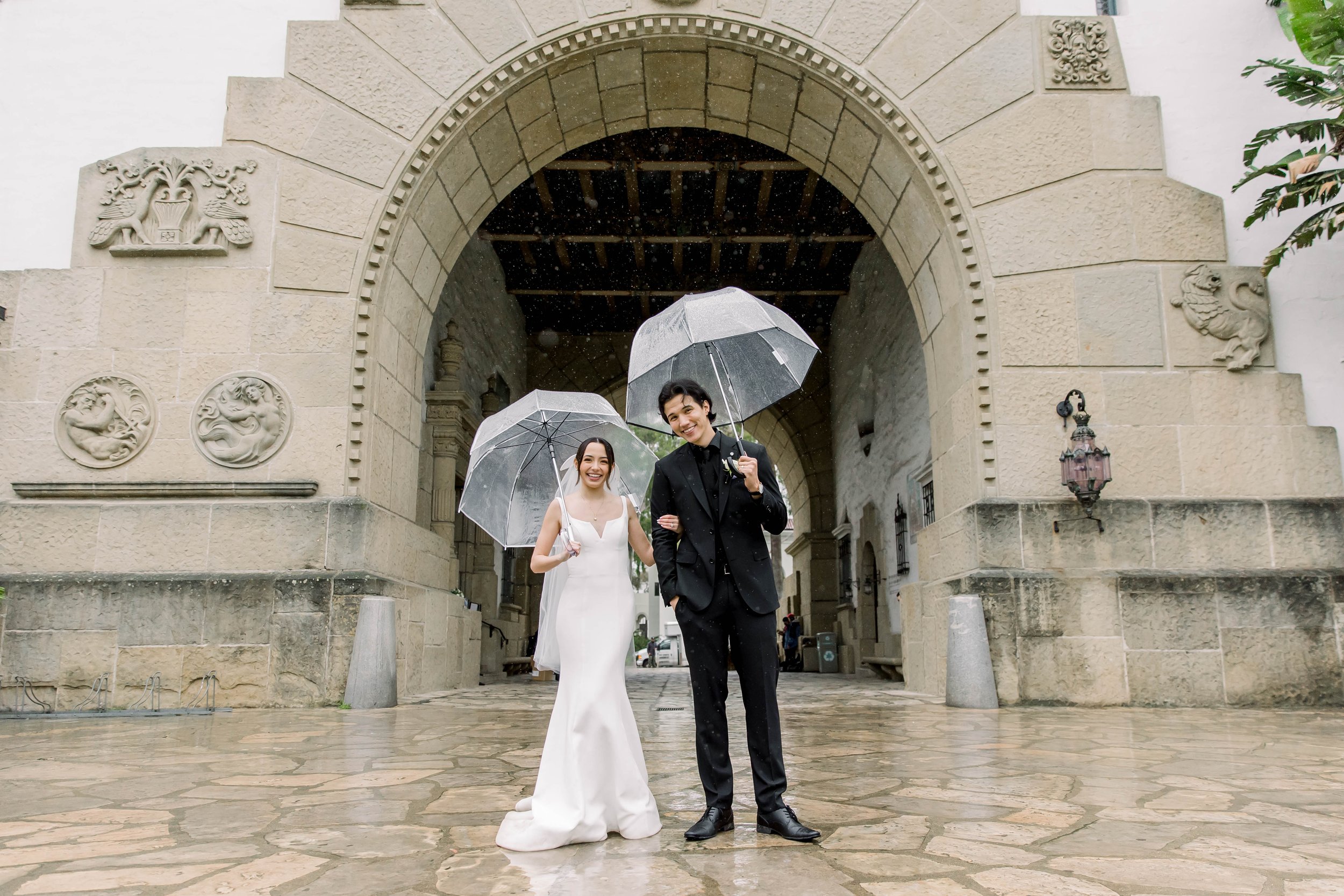 www.santabarbarawedding.com | Weddings by the Sea | Bexx Photography | Bride and Groom Under Umbrellas