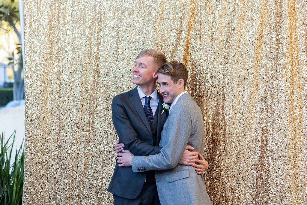 www.santabarbarawedding.com | Unitarian Society of Santa Barbara | Gatherings for Good | Grooms Embrace at Reception