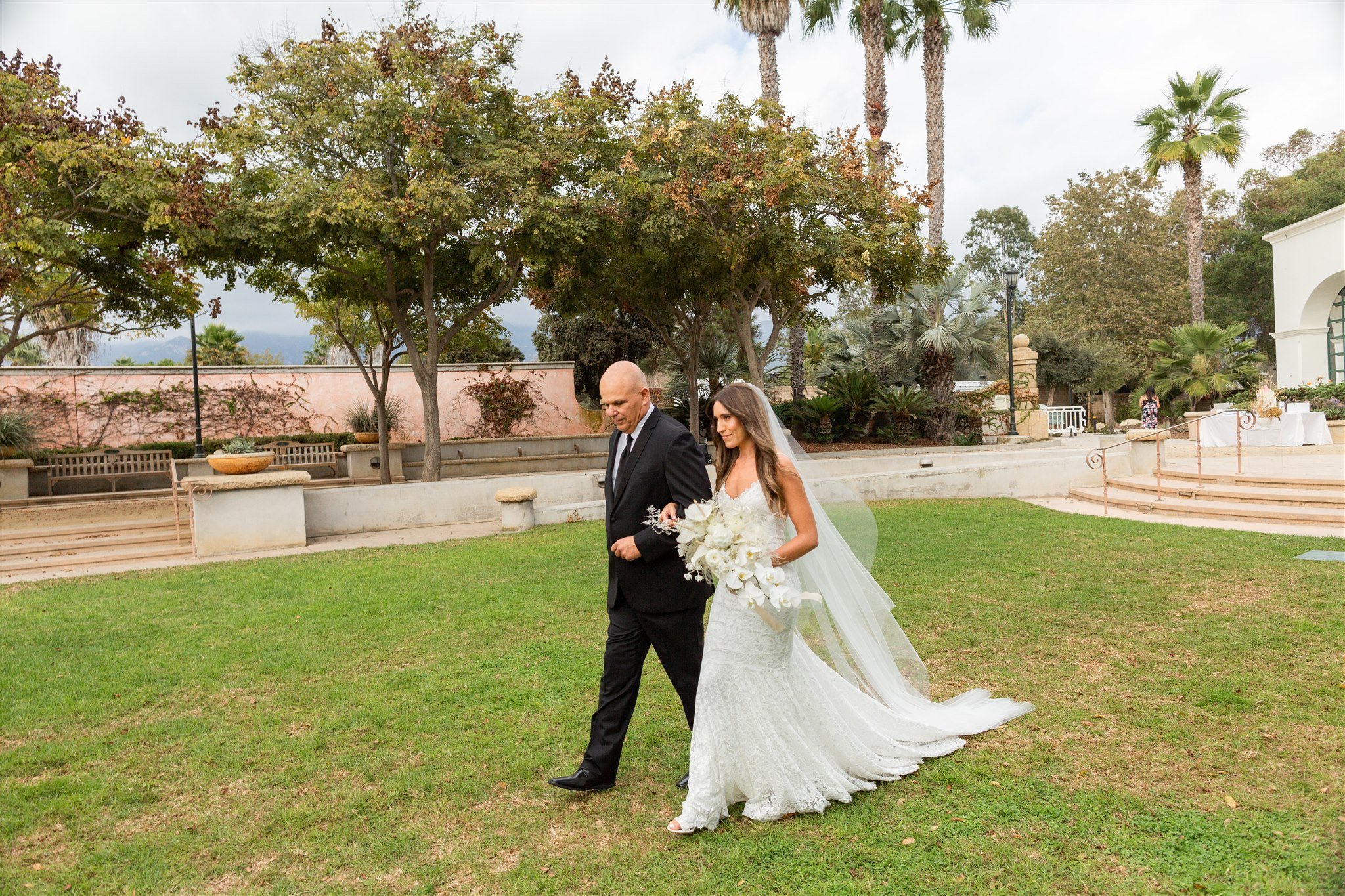 www.santabarbarawedding.com | Events by Fran | Wonder Tribe | Santa Barbara Courthouse | Wild West Florals | Amigo Party Rentals | Beauty by Leah Rose | Bride Walking Into Ceremony