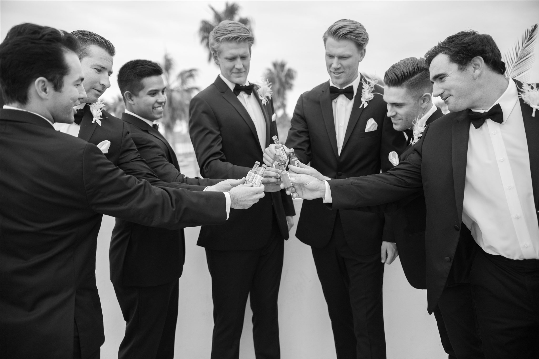 www.santabarbarawedding.com | Events by Fran | Wonder Tribe | Santa Barbara Courthouse | Groom and Groomsmen Taking a Shot Before Ceremony