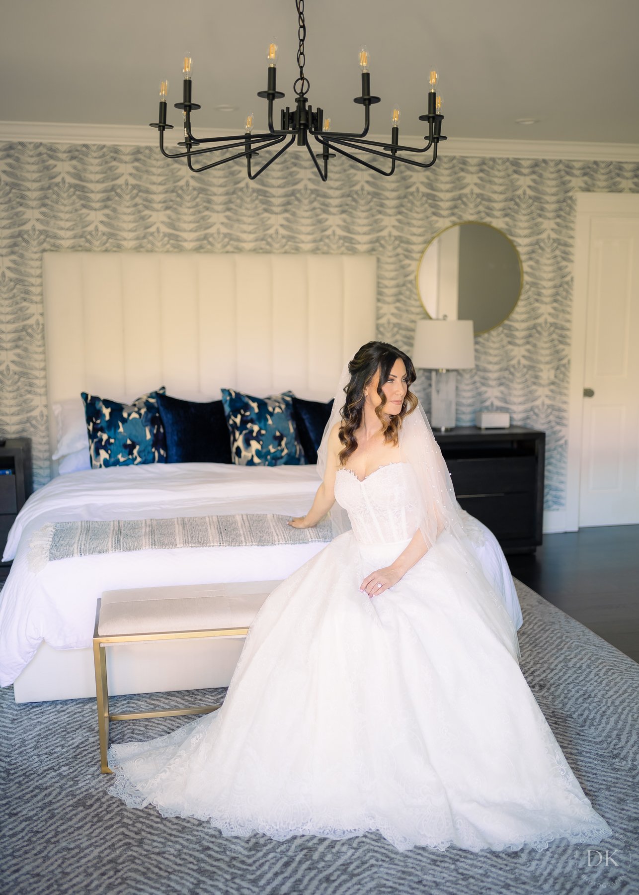 www.santabarbarawedding.com | Hidden Oaks Ranch | Bride Sitting on the Bed Inside the Venue